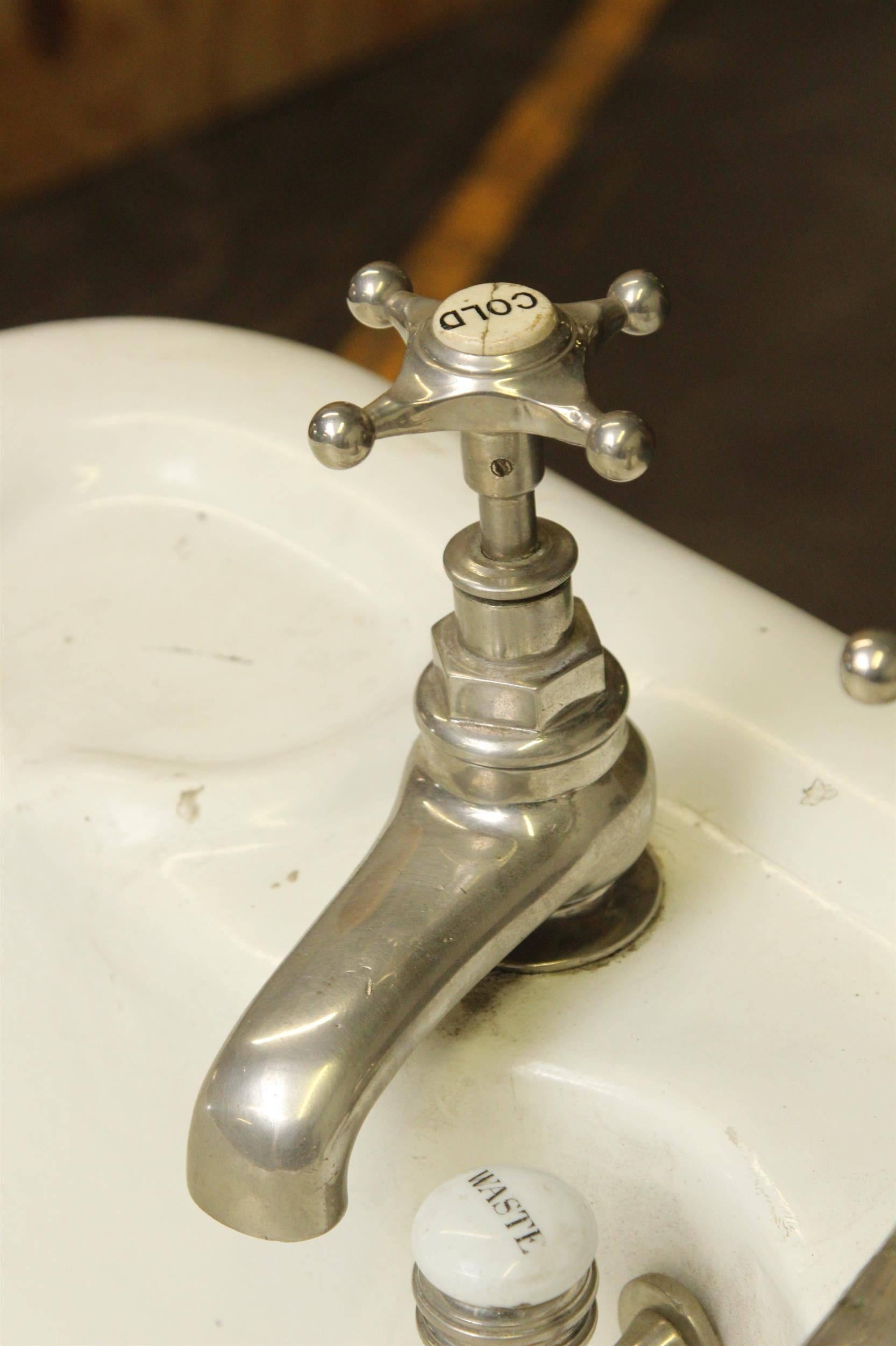 1800s unique English 6.5 foot long claw foot bathtub with soap dish and original hardware still attached. Unusually tall and with wide rims. This can be seen at our 400 Gilligan St warehouse in Scranton, PA.