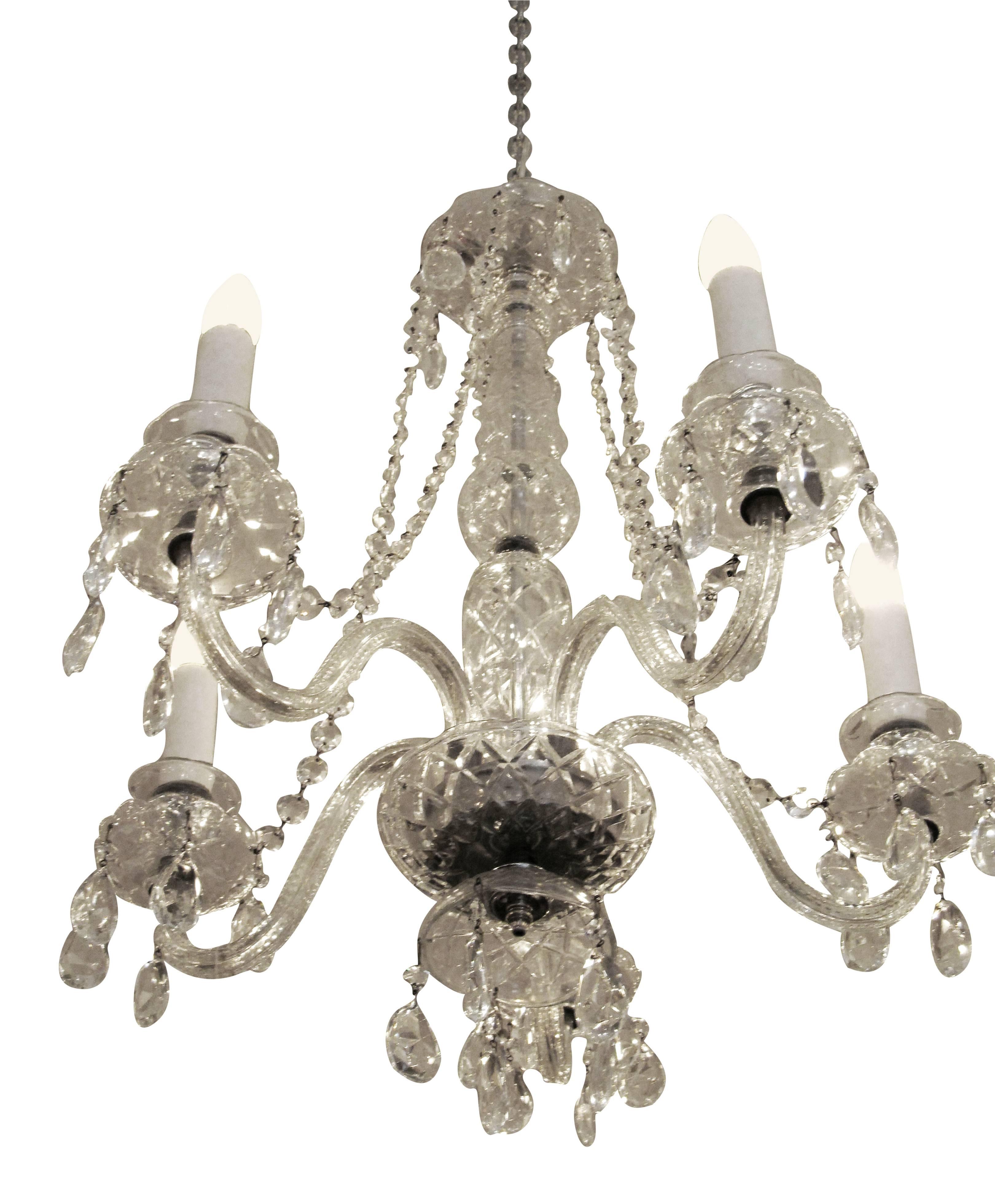 1940s Restored crystal five-arm chandelier. Made in Waterford, Ireland. Waterford crystal is renowned for its brilliance due to the minerals in the sand used to make the crystal. Please specify the overall drop that is needed upon purchasing. This