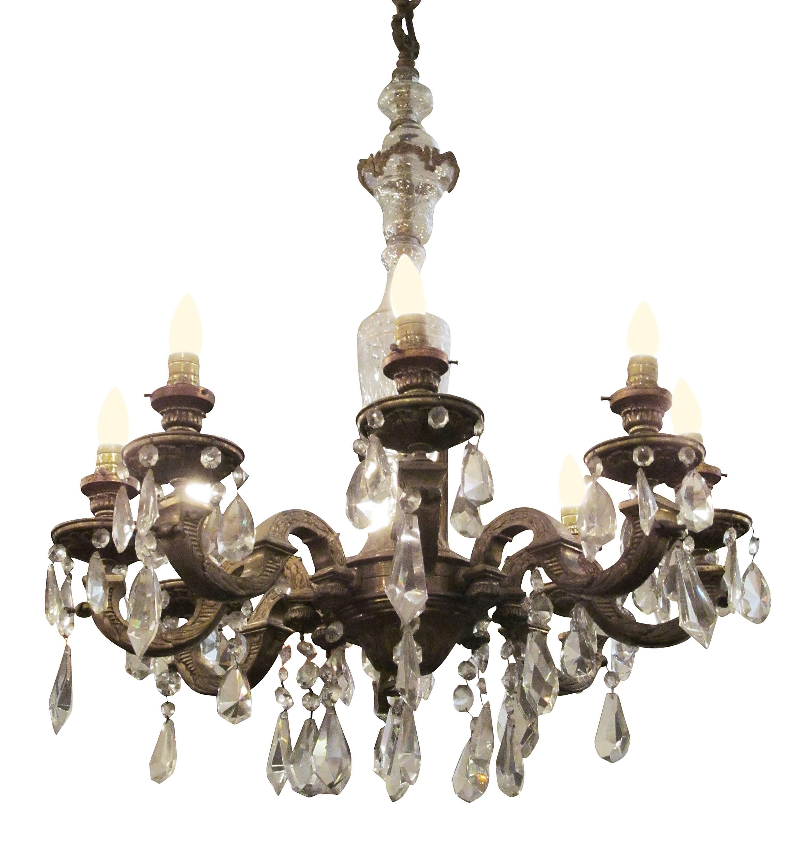 1930s bronze and crystal chandelier with eight arms. This chandelier is missing the original shades.  Price includes cleaning & wiring restoration. This can be seen at our 333 West 52nd St location in the Theater District West of Manhattan.