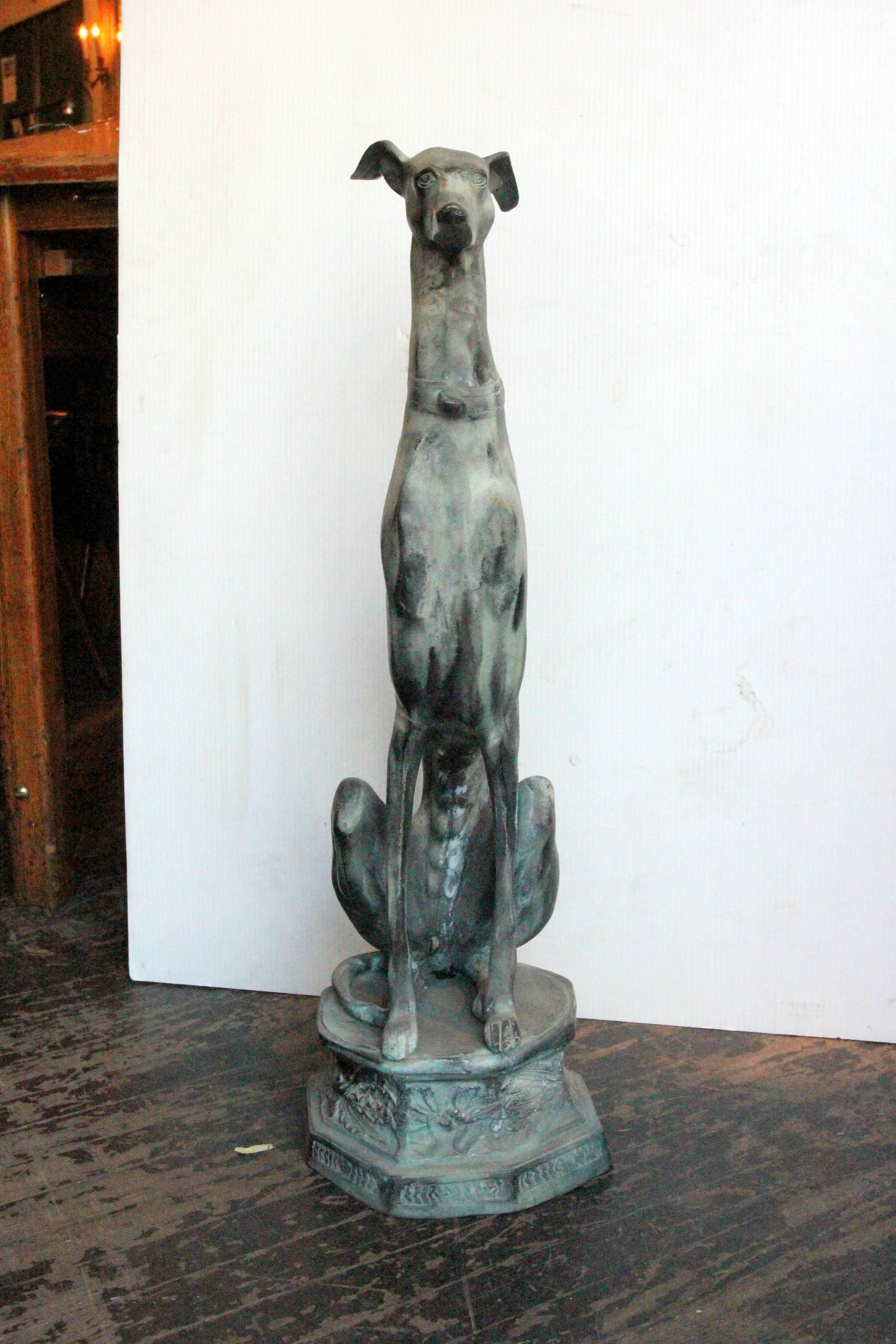 1980s bronze statue of a greyhound sitting attentively with his ears pointed back. This item can be seen at our 302 Bowery location in Manhattan.