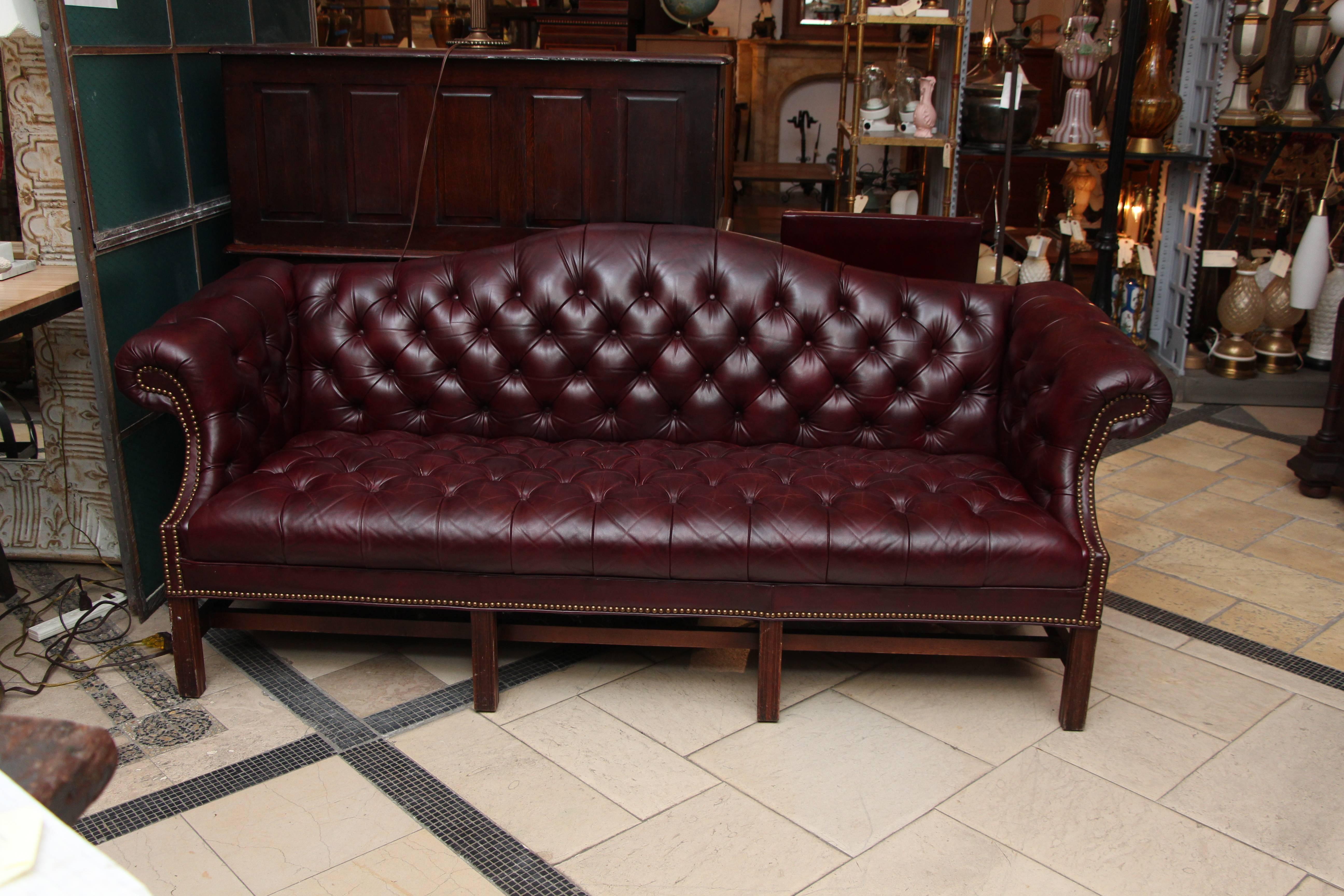 1980s tufted burgundy Chesterfield leather sofa and chair set with hickory wood manufactured by Hickory Leather Company. This set can be viewed at our 5 East 16th St, Union Square location in Manhattan.