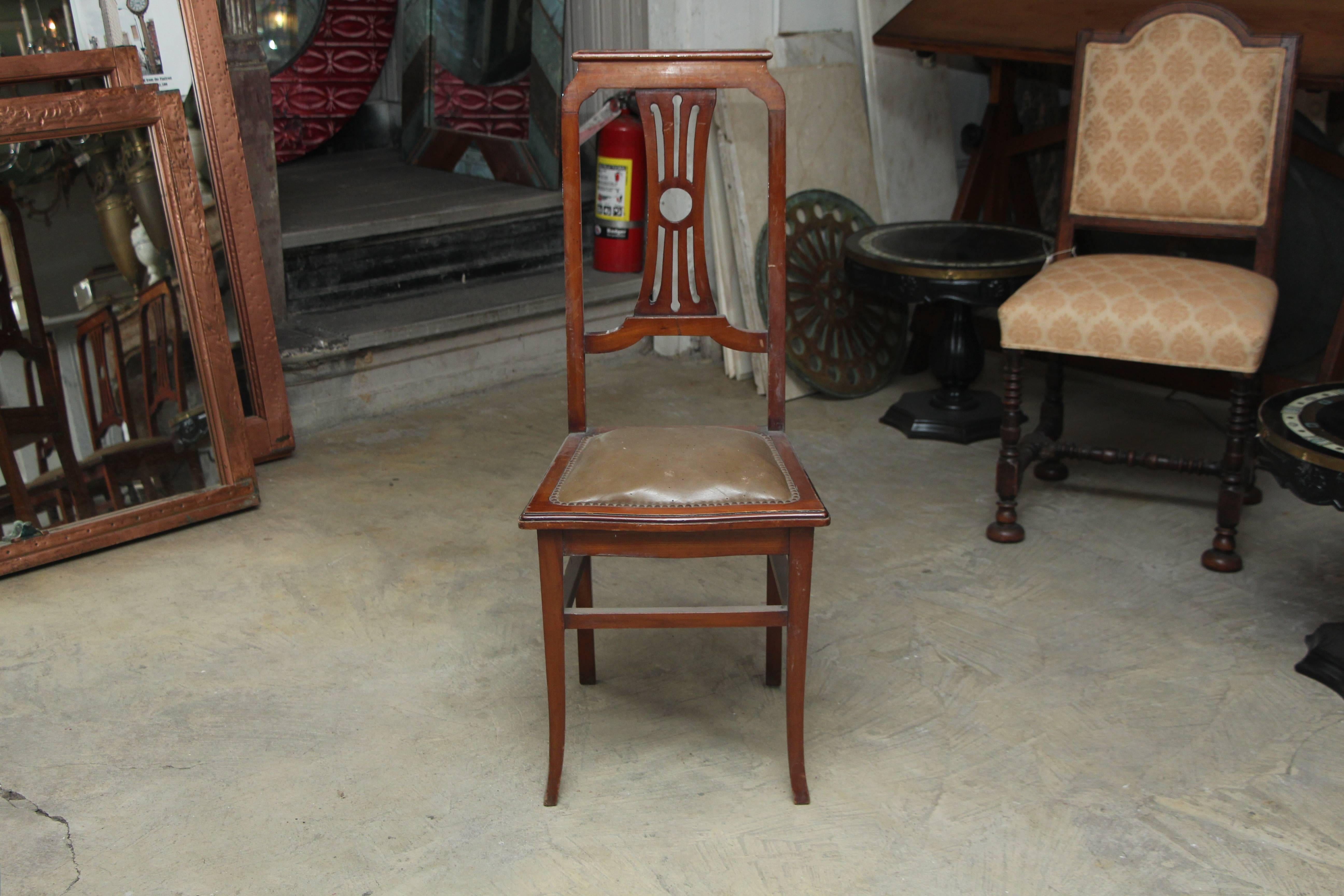1940s set of simple French tall Lyre back carved wood dining chairs with riveted leather seat. Leather has some pitting and wear. Overall very good antique condition. Priced as a set. These can be viewed at our 5 East 16th St, Union Square location