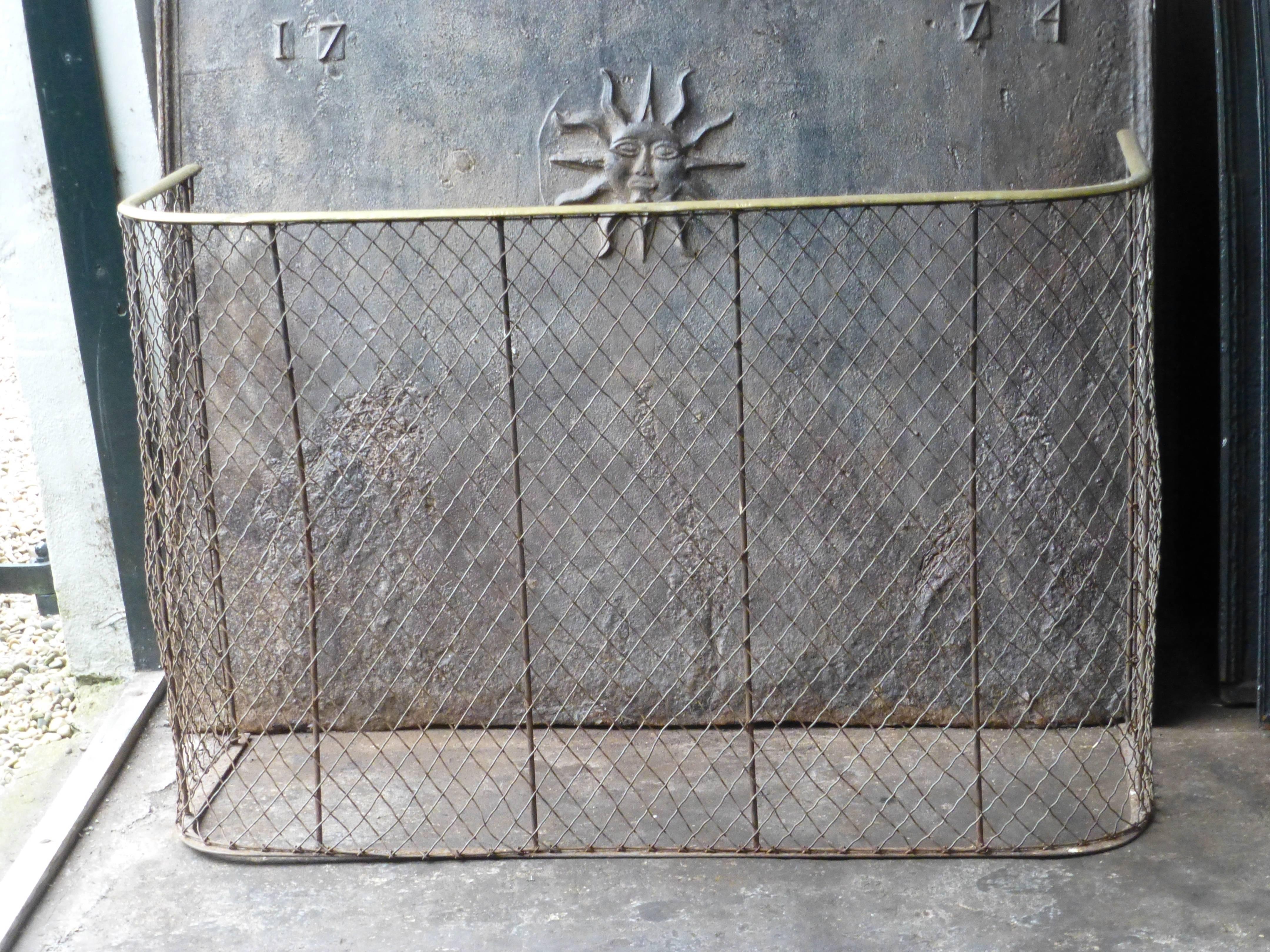 19th century English brass and iron fire guard.

We have a unique and specialized collection of antique and used fireplace accessories consisting of more than 1000 listings at 1stdibs. Amongst others we always have 300+ firebacks, 250+ pairs of