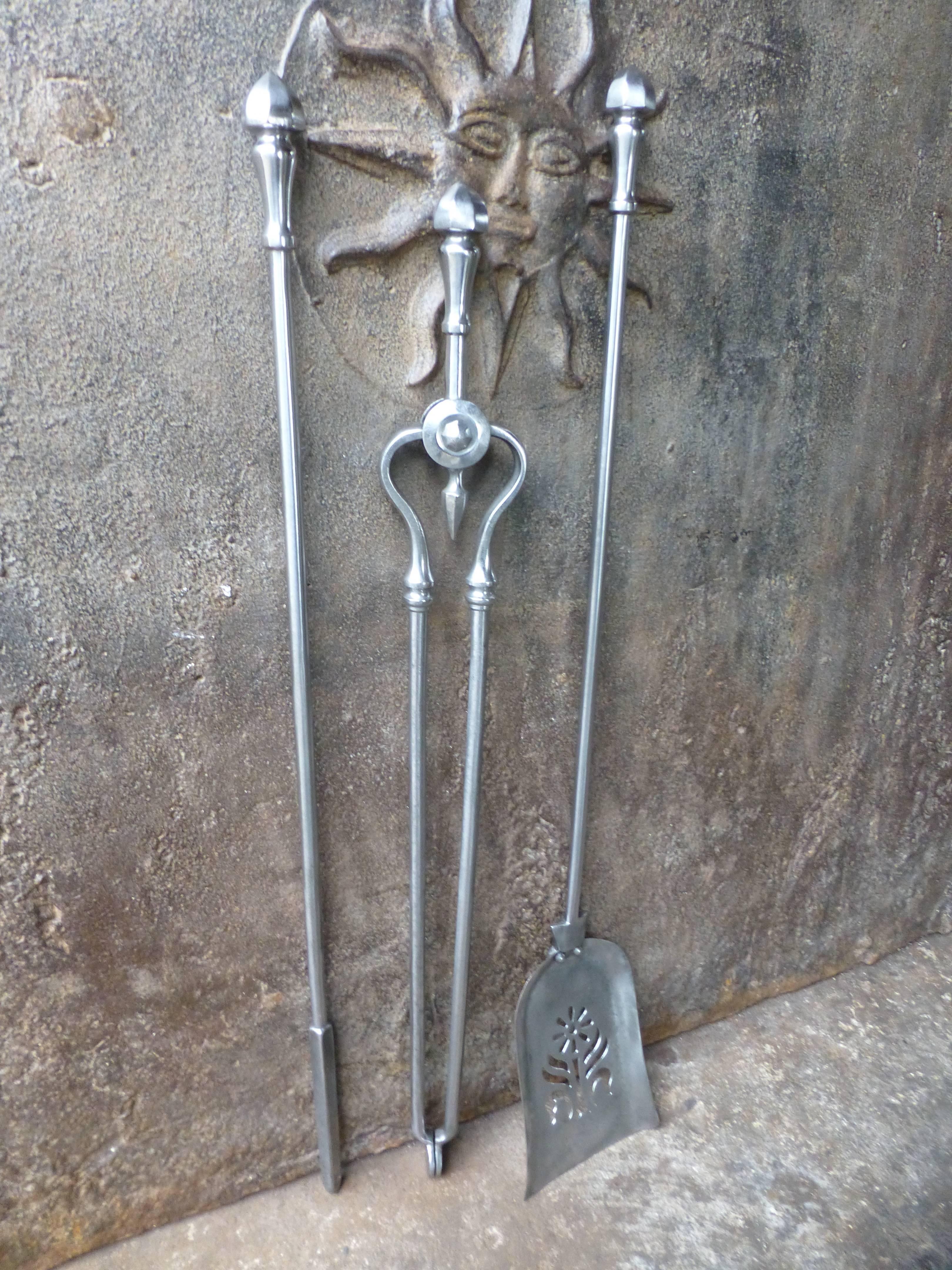 19th century English fireplace tools of polished steel.

 