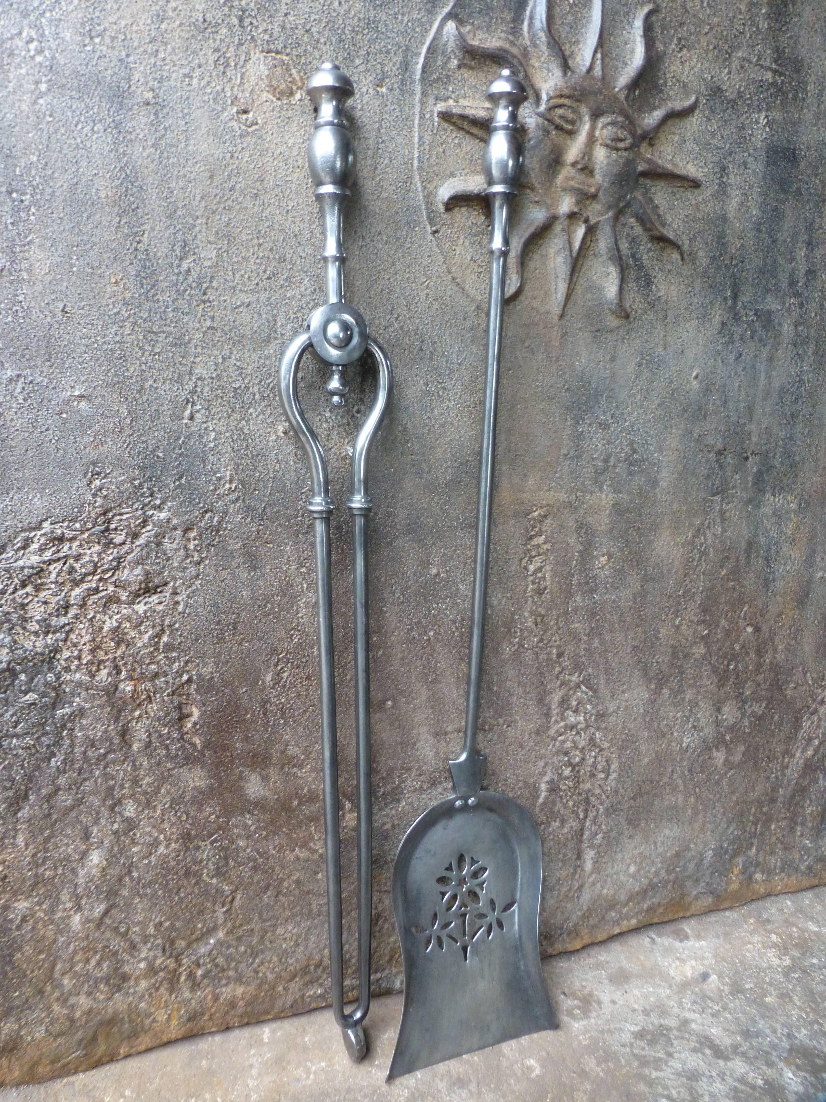 19th century English fire irons made of polished steel.

 
