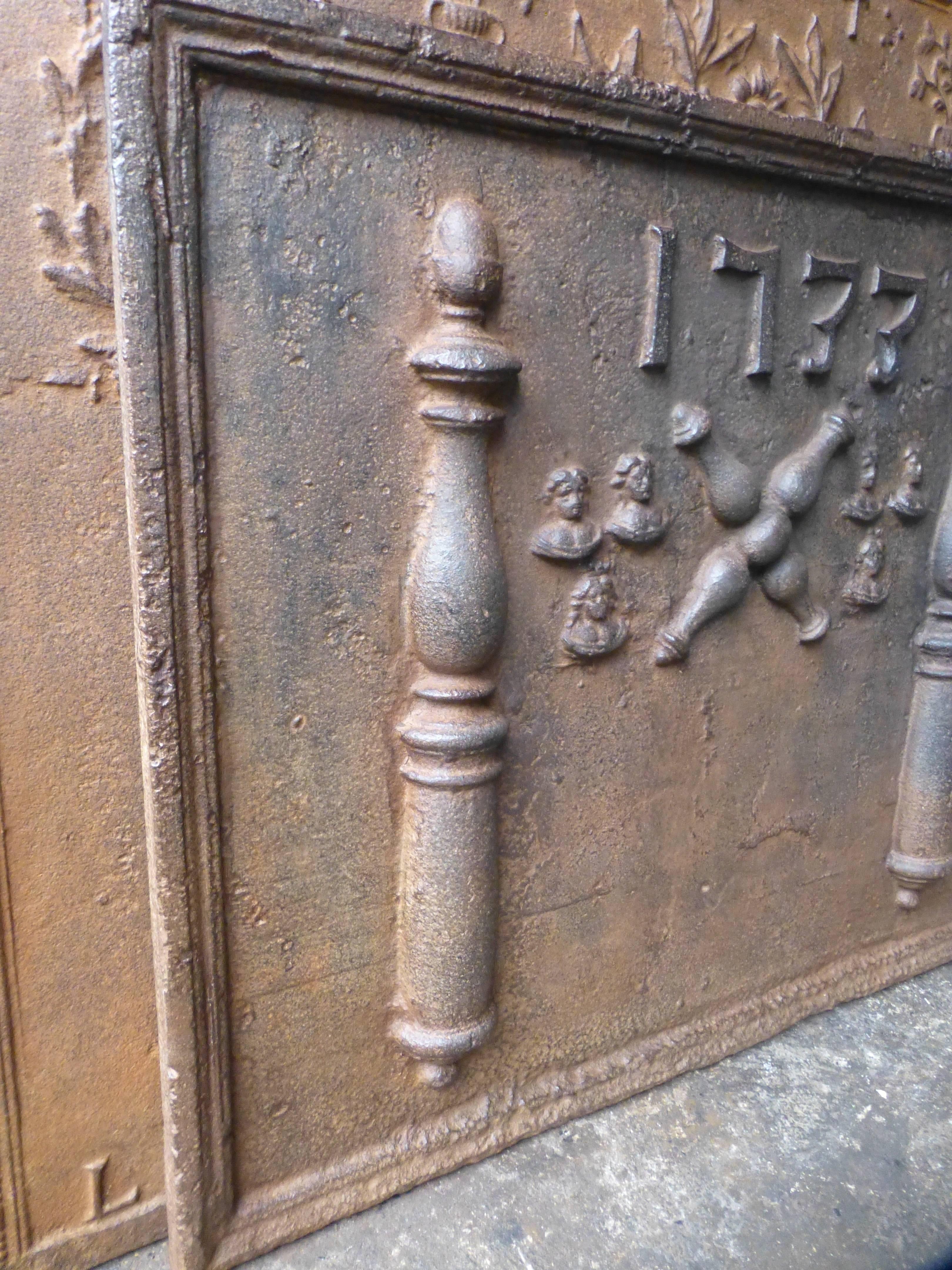 18th century French fireback with pillars, a decoration and the date 1733.

The fireback is made of cast iron and has a natural brown patina. Upon request it can be made black / pewter. The condition is good, no cracks.

All our products that weigh
