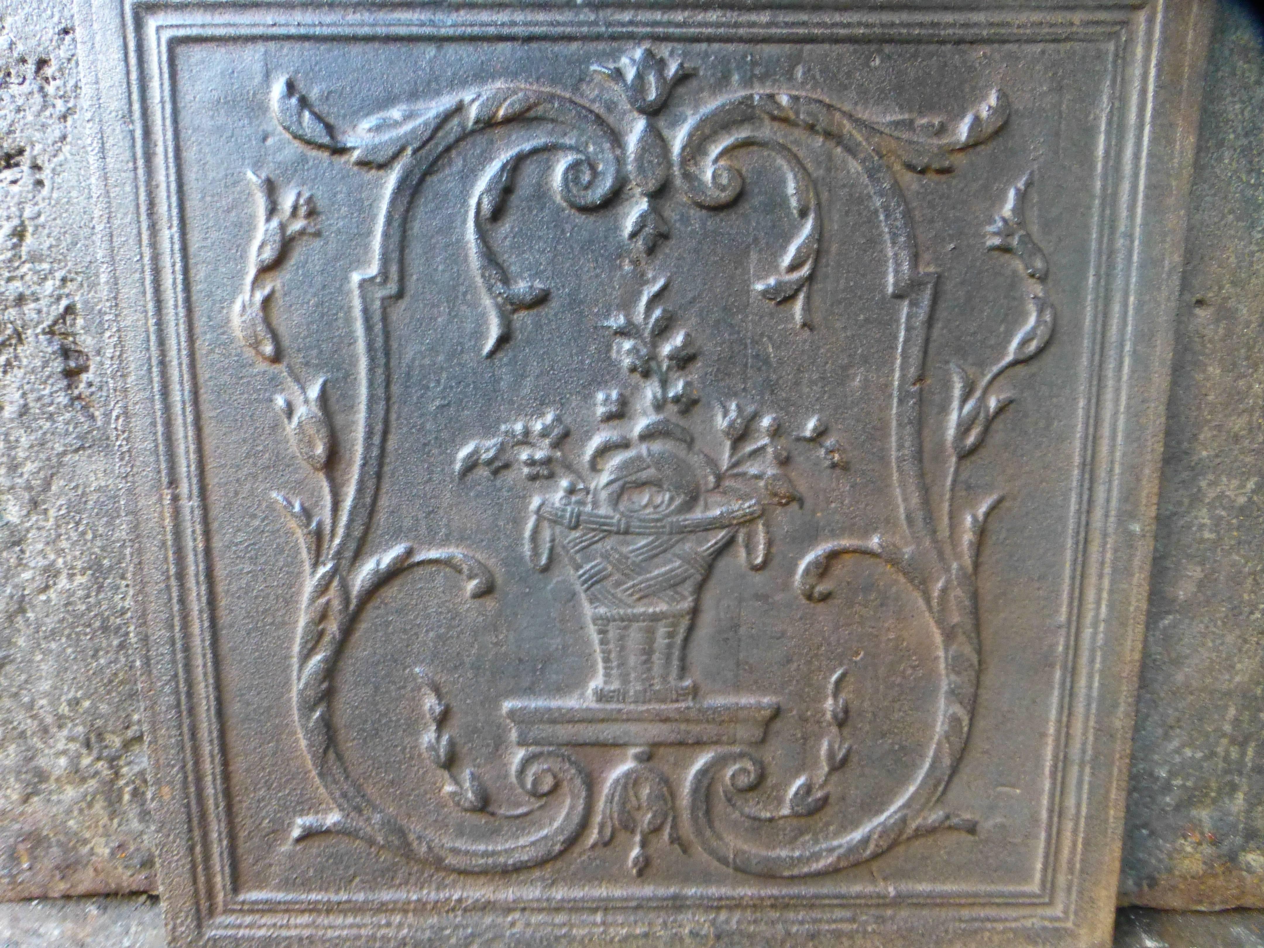 19th century French fireback with a flower basket.