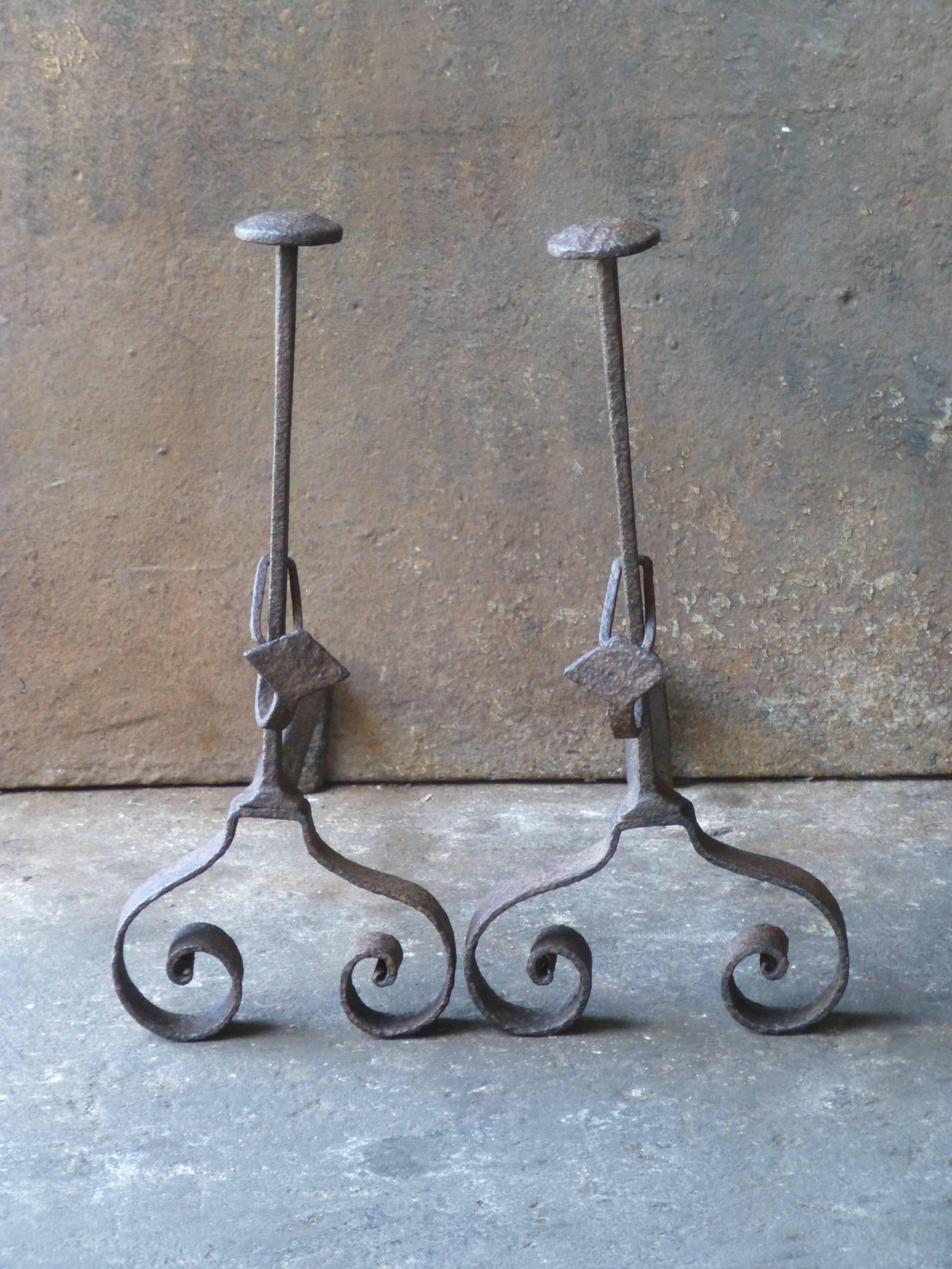 18th century French firedogs - andirons made of wrought iron. The firedogs have spit hooks.