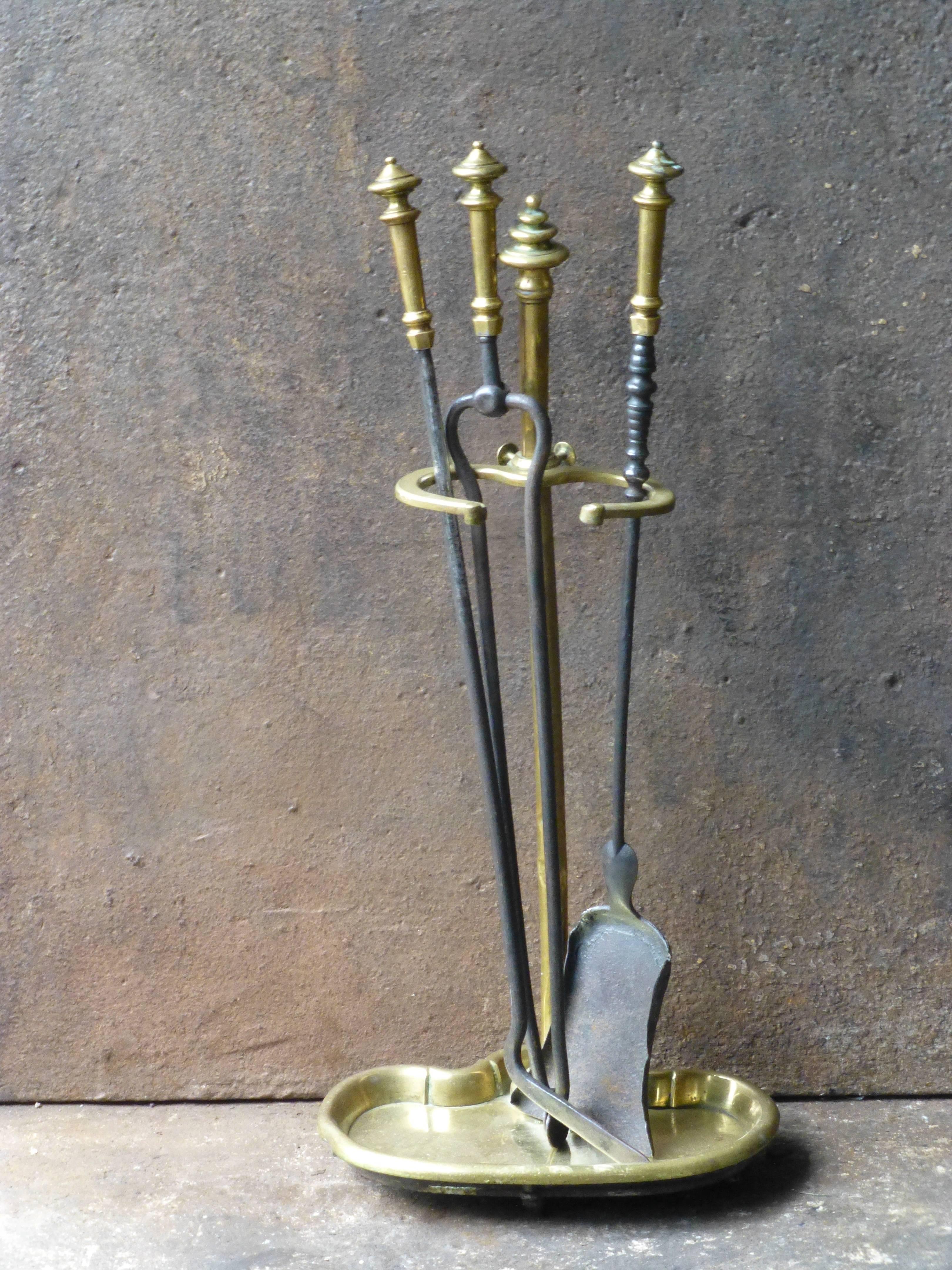 19th century English fireplace tool set or fire tools made of brass and wrought iron.