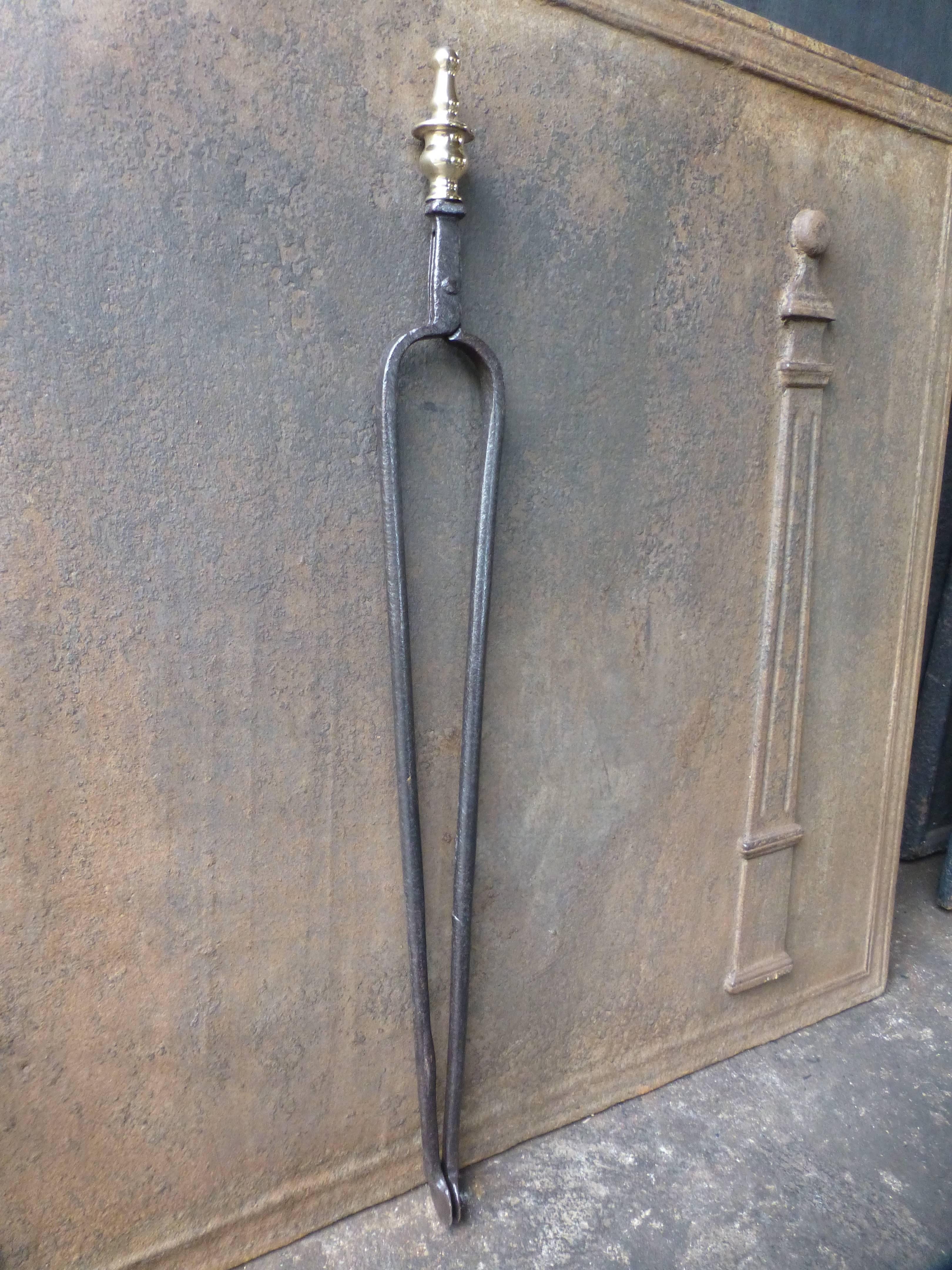 17th-18th century Dutch fire tongs made of wrought iron and polished brass.