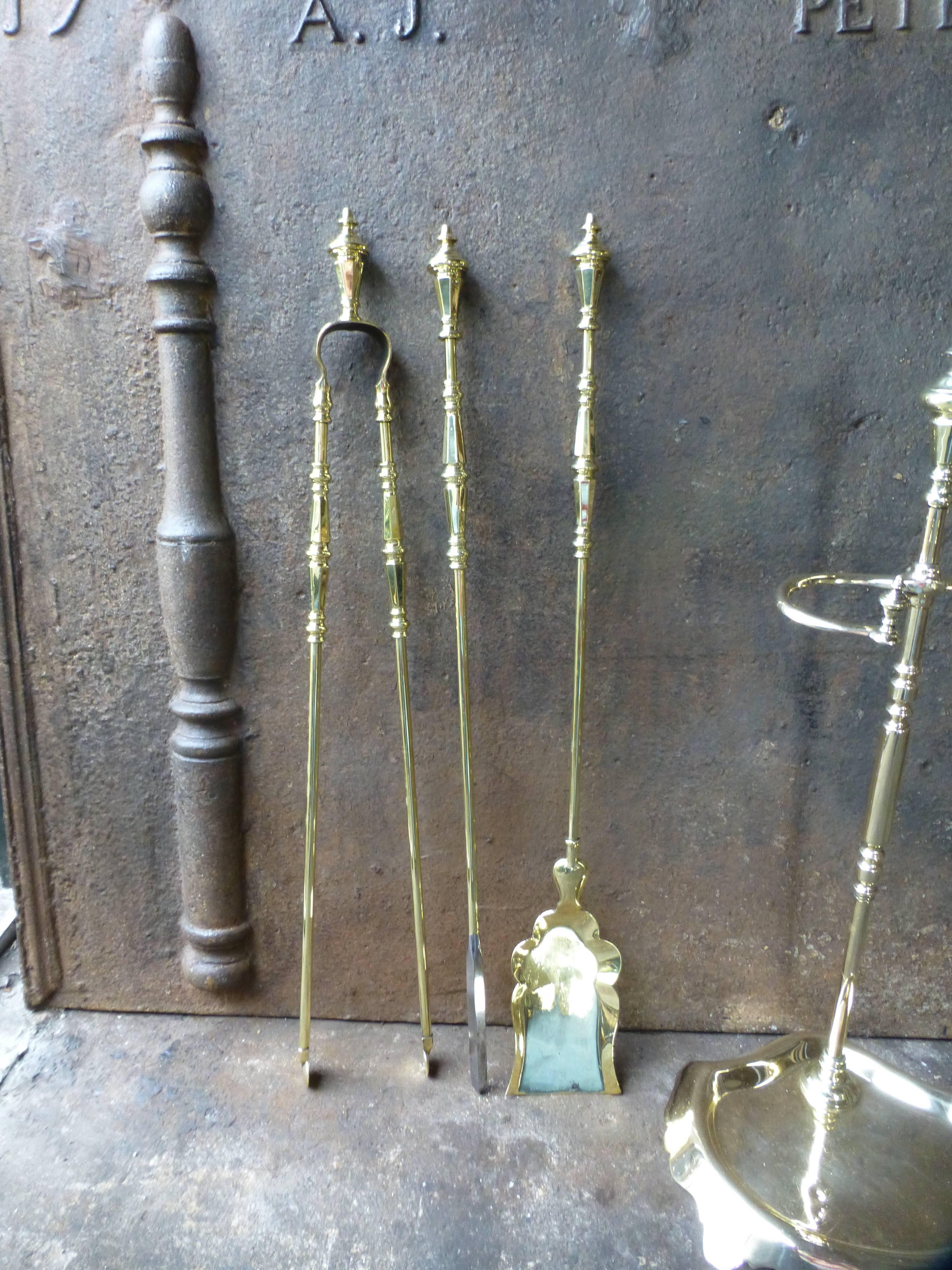 19th century French fire tools, fire irons made of brass. The set is signed by Bouhon Frères.