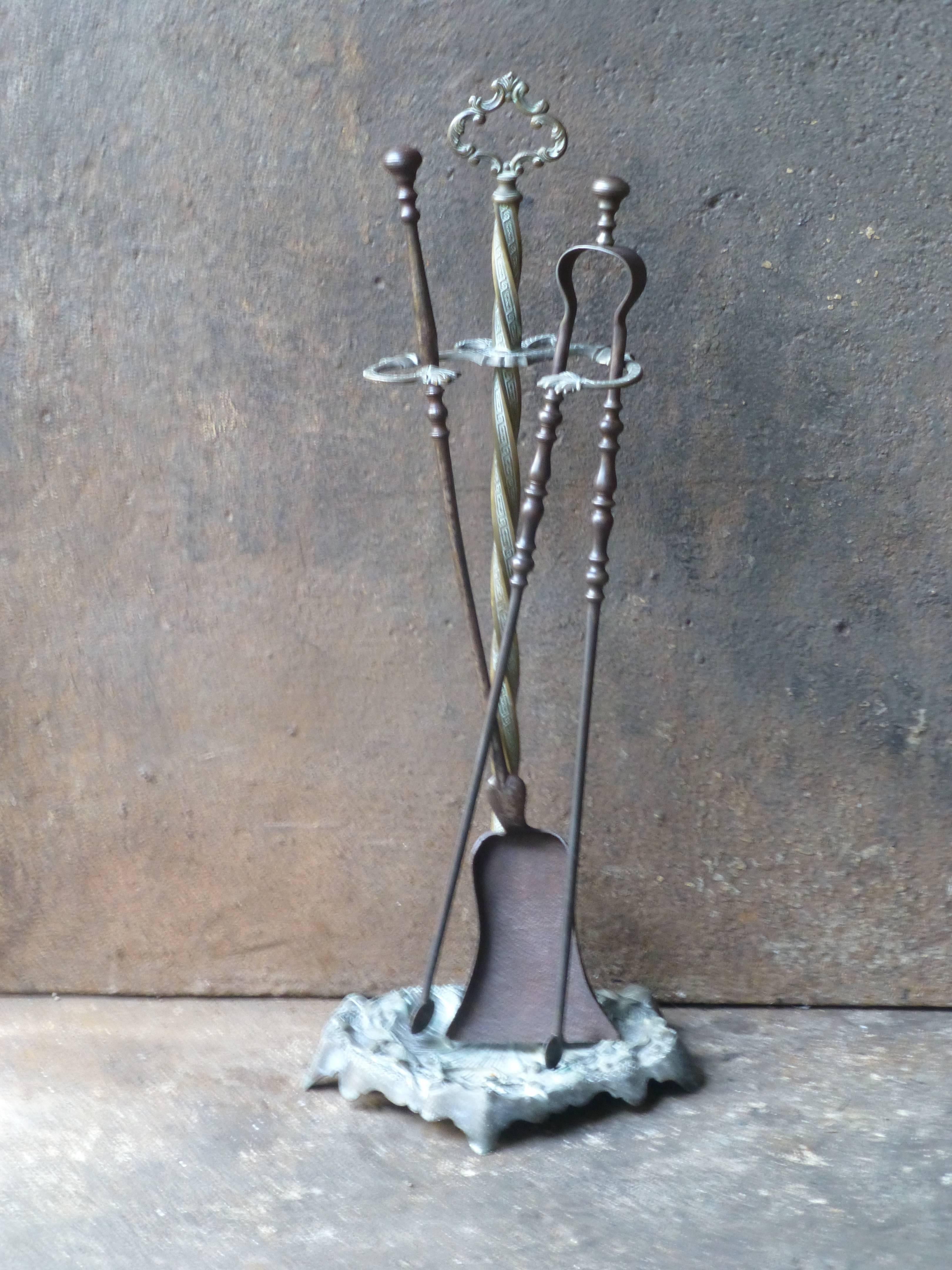 19th century French fireplace tool set made of wrought iron.