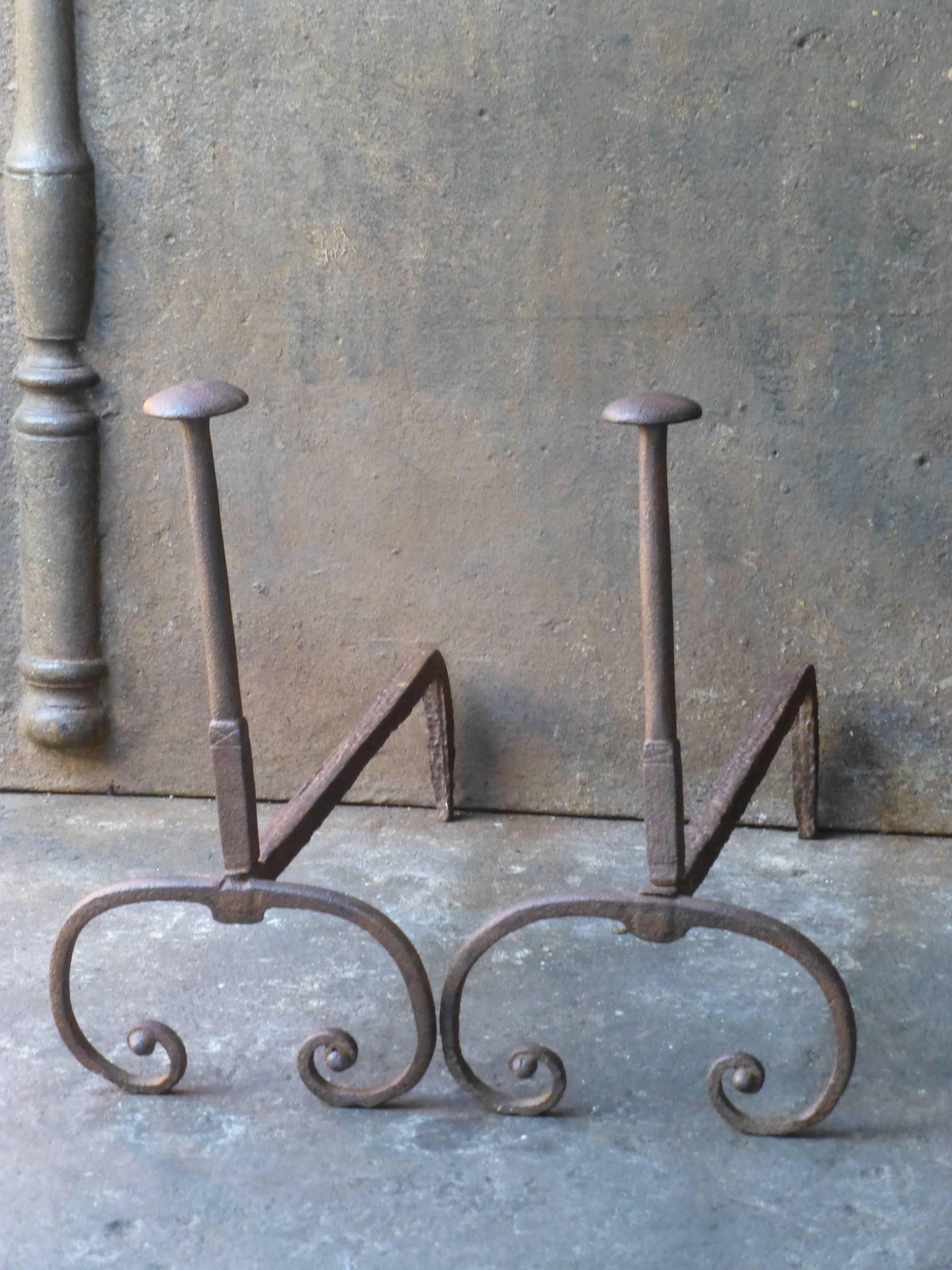 18th century French andirons made of wrought iron.