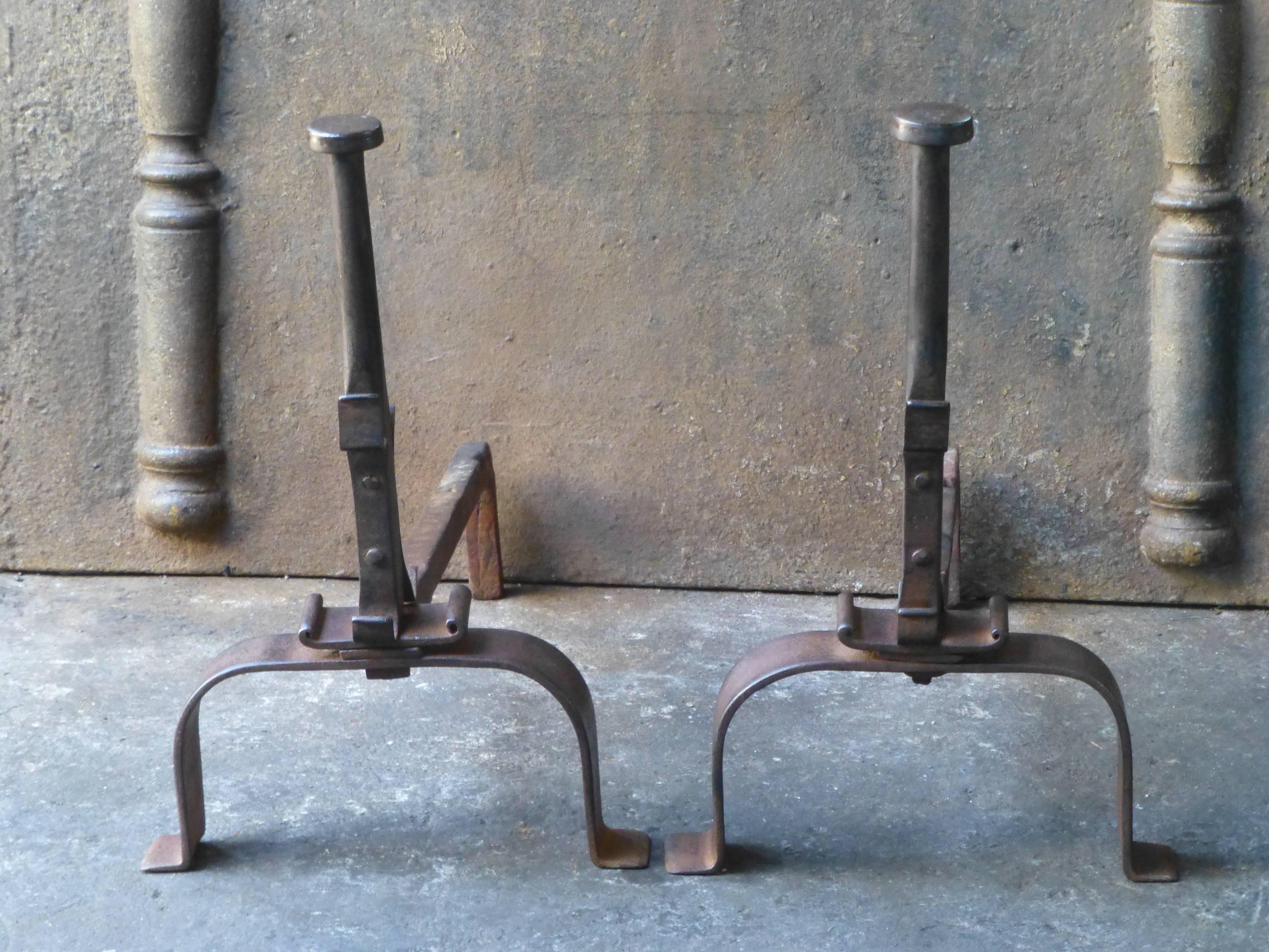 19th century French Napoleon III period andirons or fire dogs made of wrought iron. The andirons have spit hooks. The condition is good.