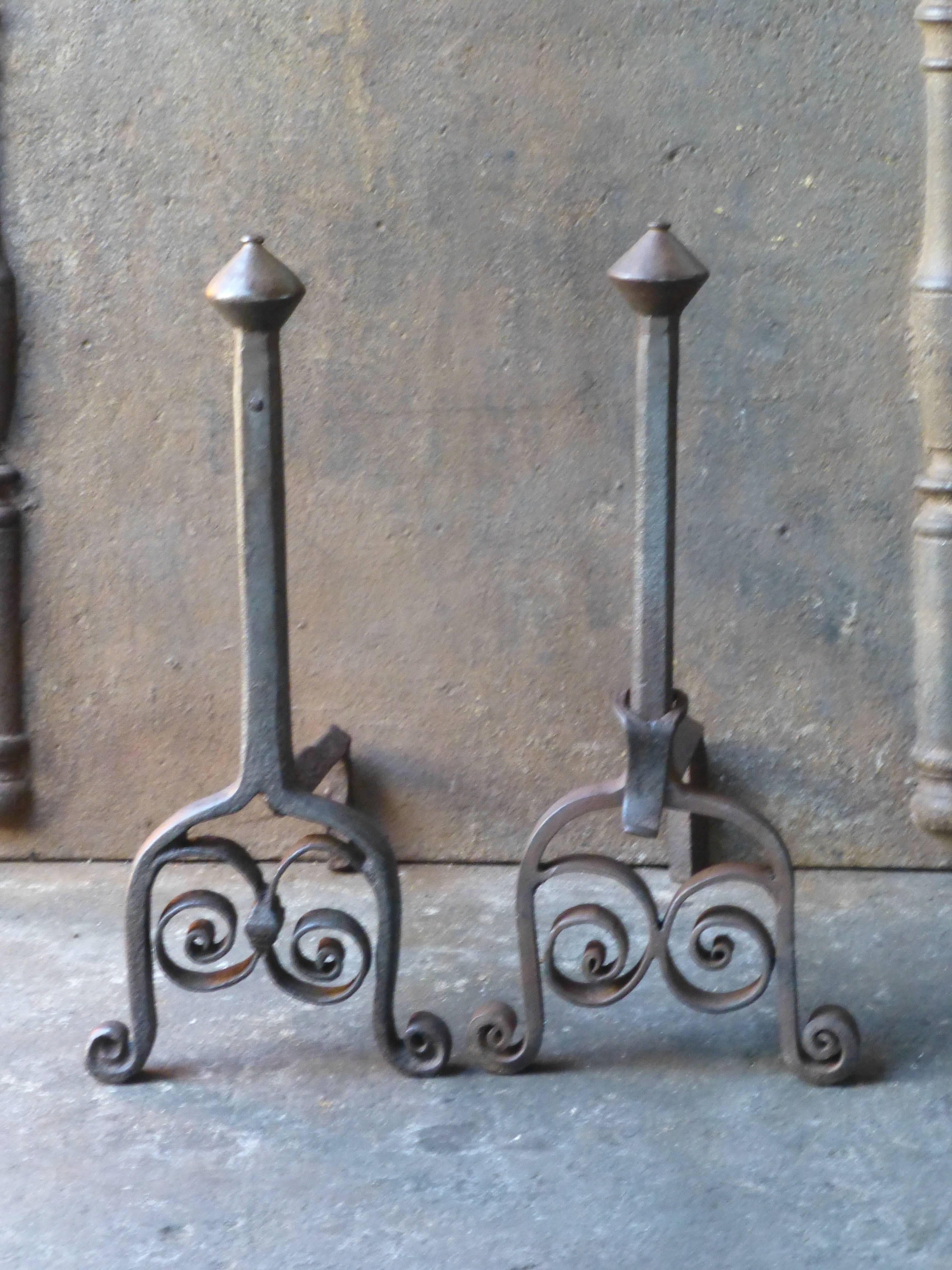 18th century French andirons or fire dogs made of wrought iron.