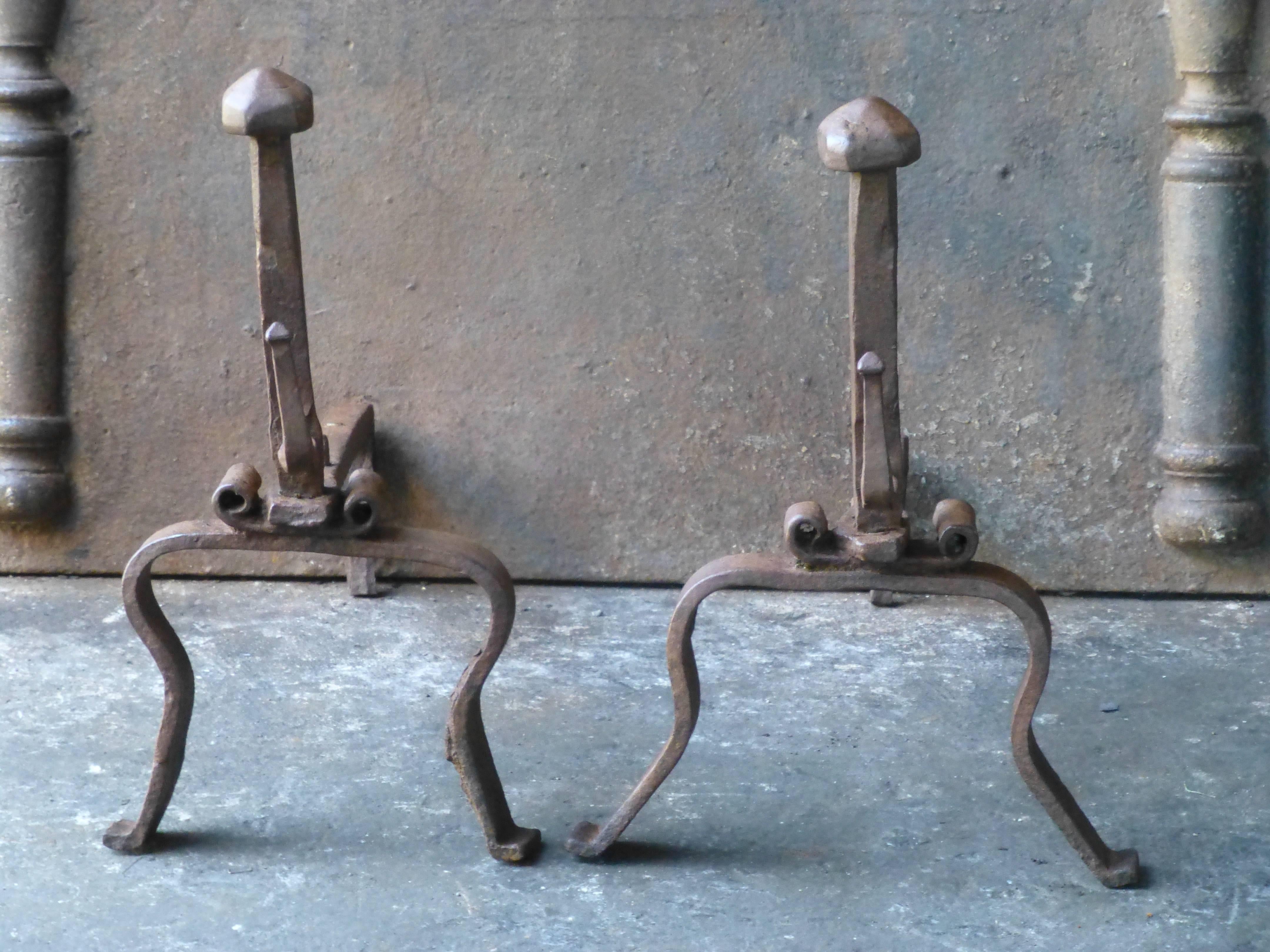 18th century Louis XV firedogs made of wrought iron. The condition is good.