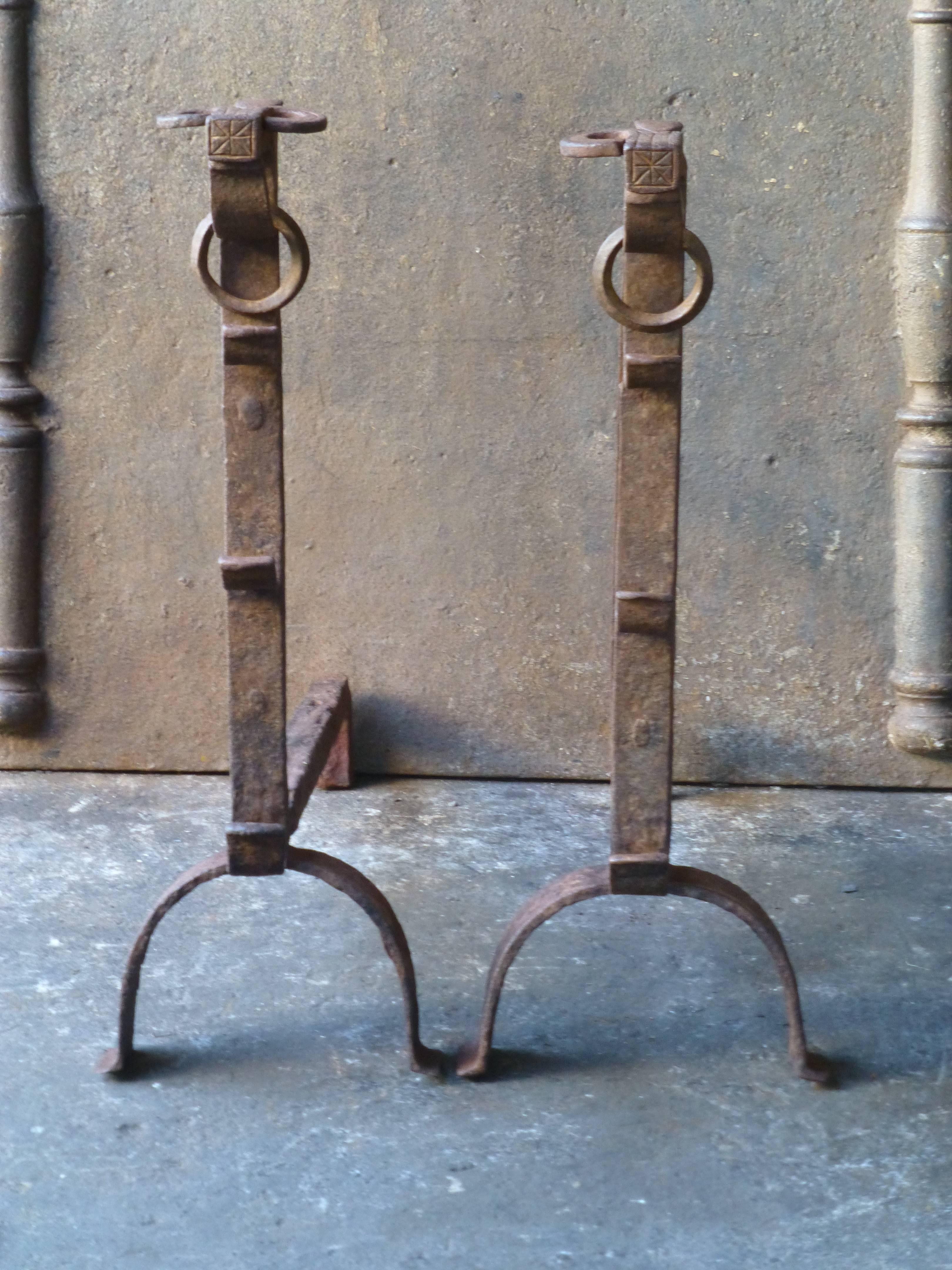 17th century Gothic bulls head fire dogs, andirons. These French andirons are called 'landiers' in France. This dates from the times the andirons were the main cooking equipment in the house. They had spit hooks to grill meat or poultry and