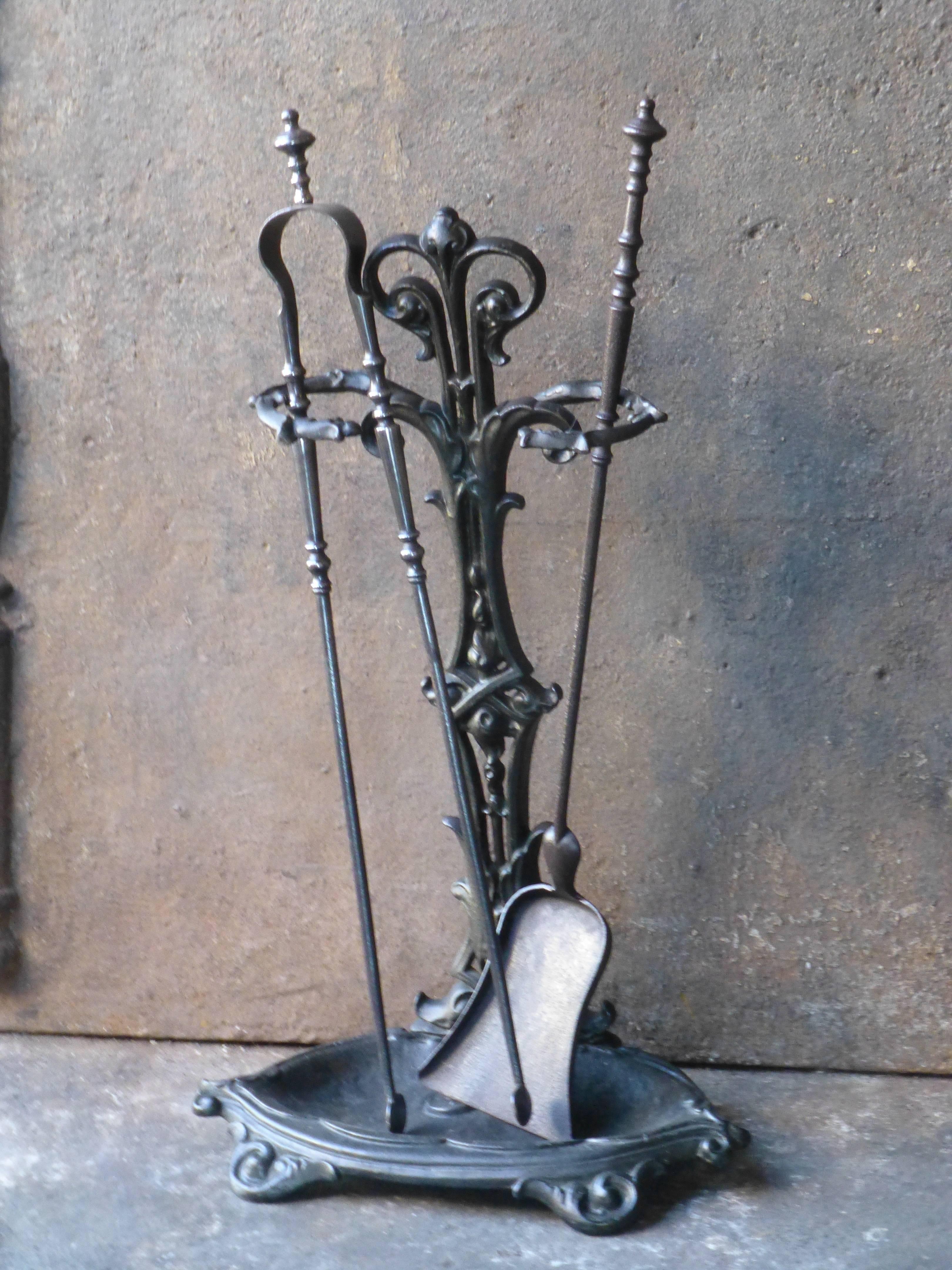 19th century French fireplace tool set.

We have a unique and specialized collection of antique and used fireplace accessories consisting of more than 1000 listings at 1stdibs. Amongst others we always have 300+ firebacks, 250+ pairs of andirons and