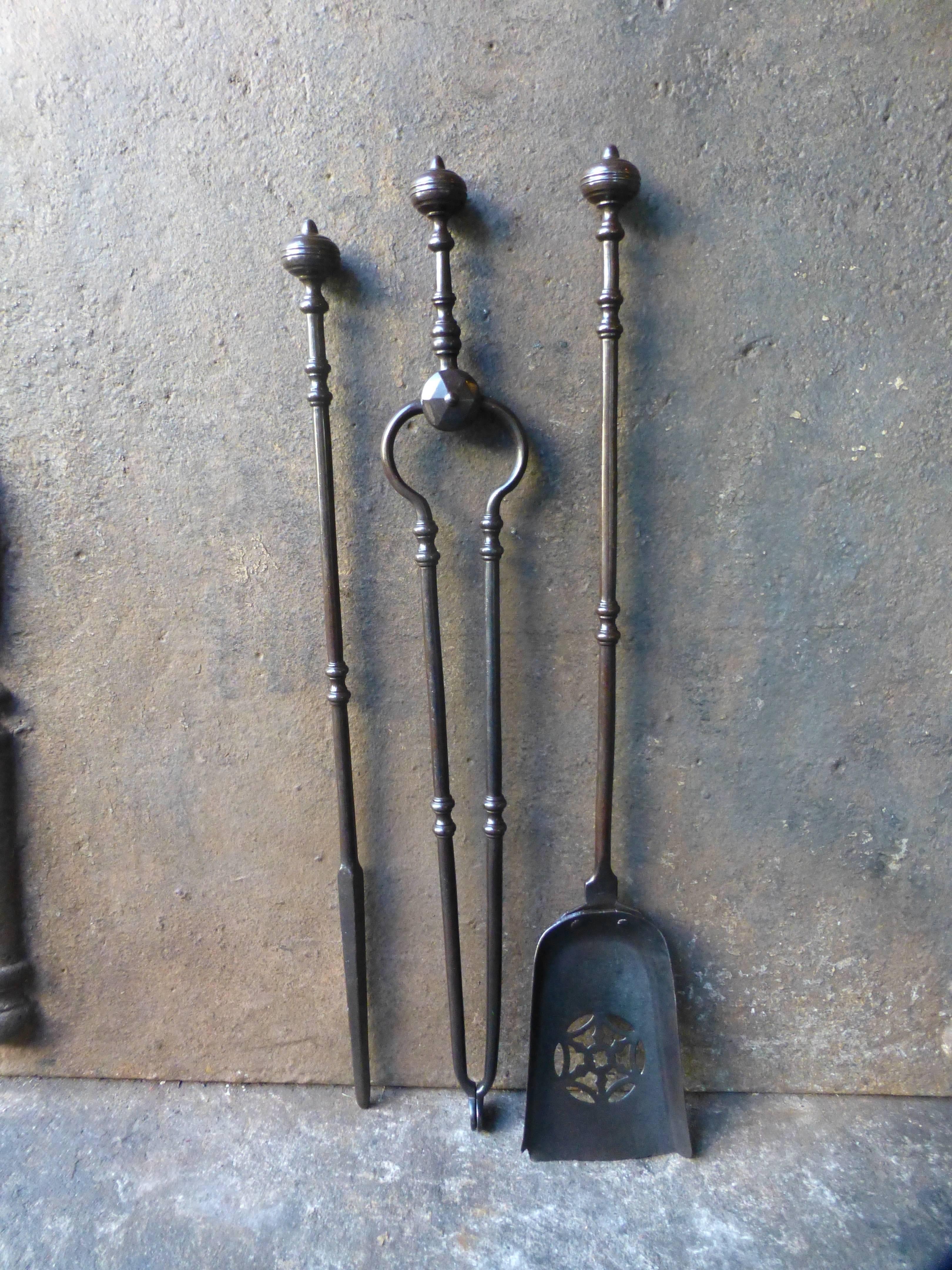 19th century English fireplace tool set.