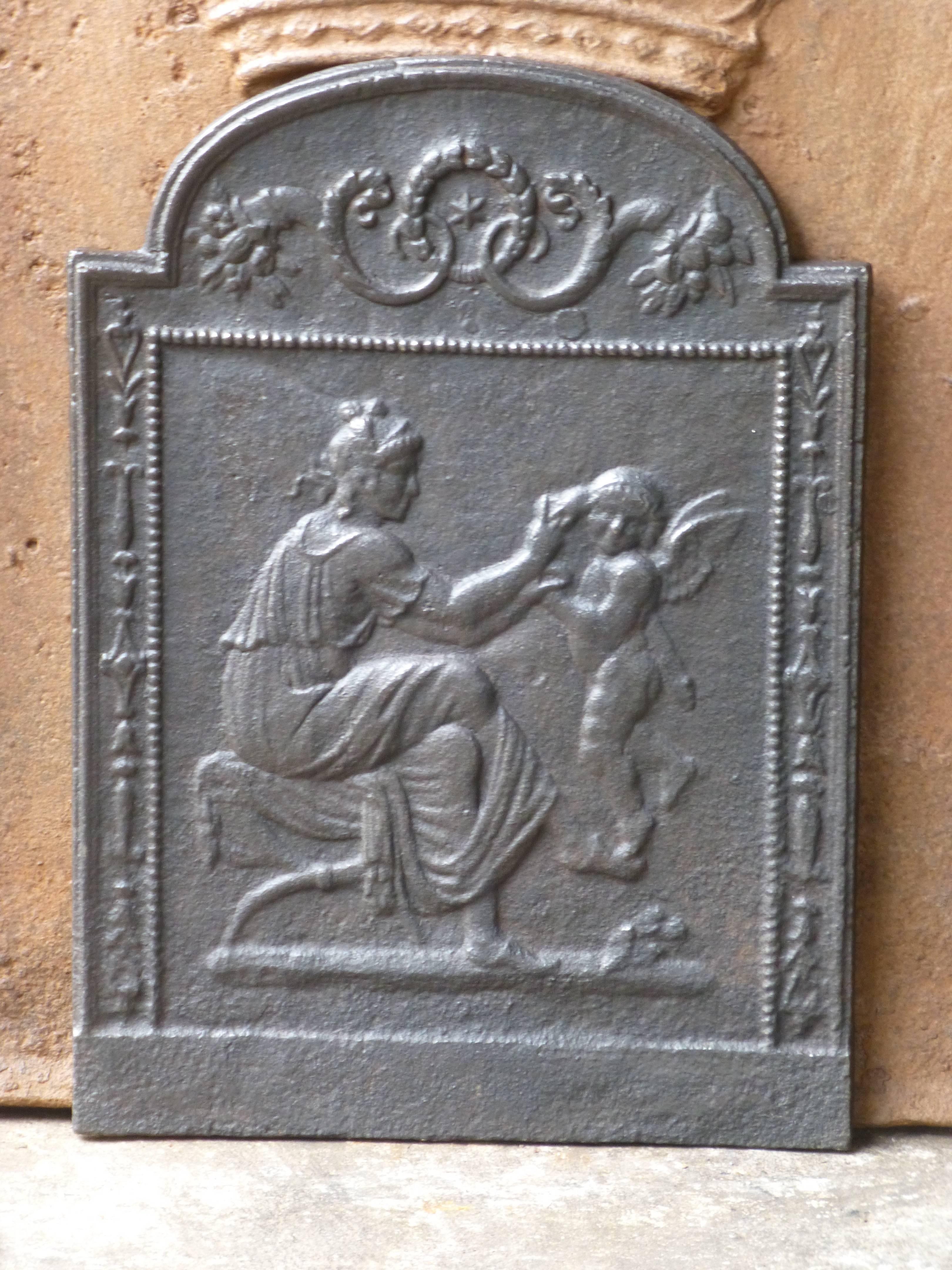 19th century French fireback with a woman and a cupid.