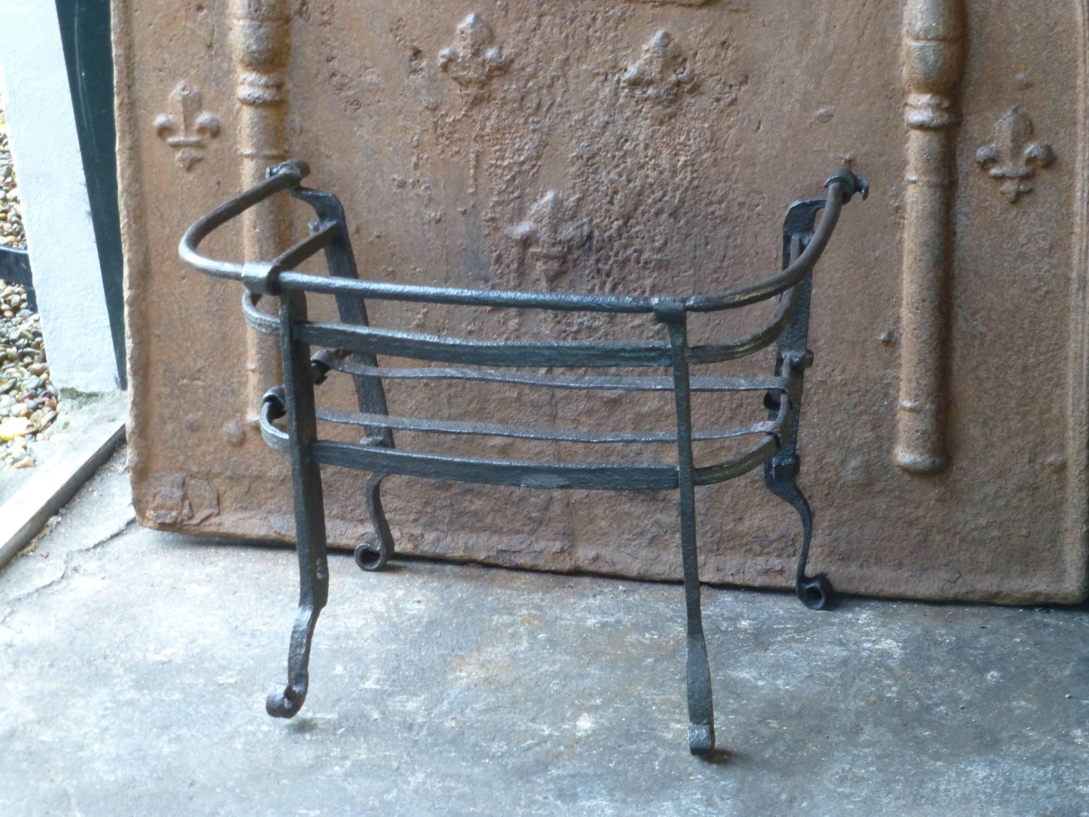 17th century English fireplace grate made of wrought iron.