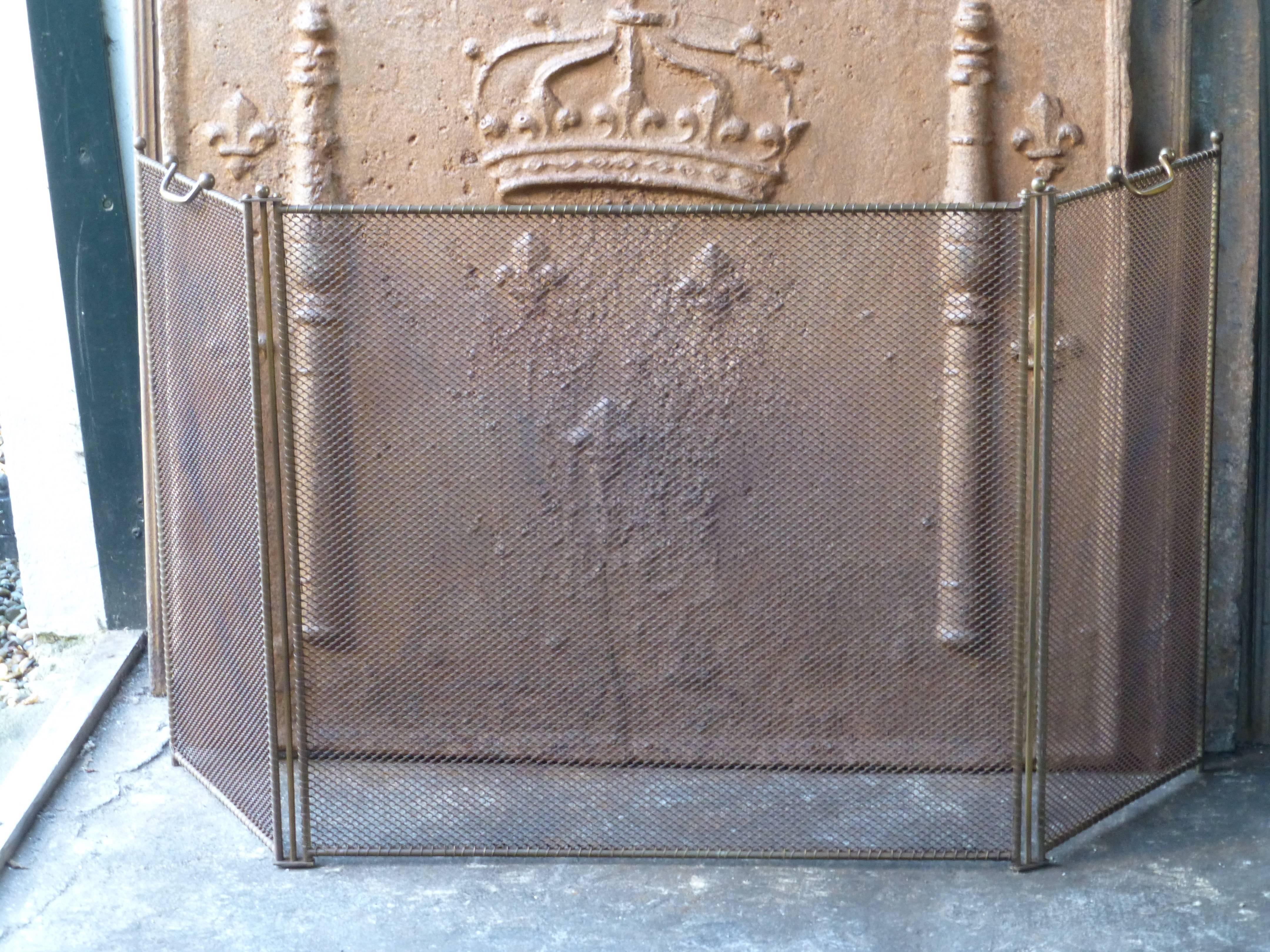 19th century French fireplace screen made of iron and iron mesh.
