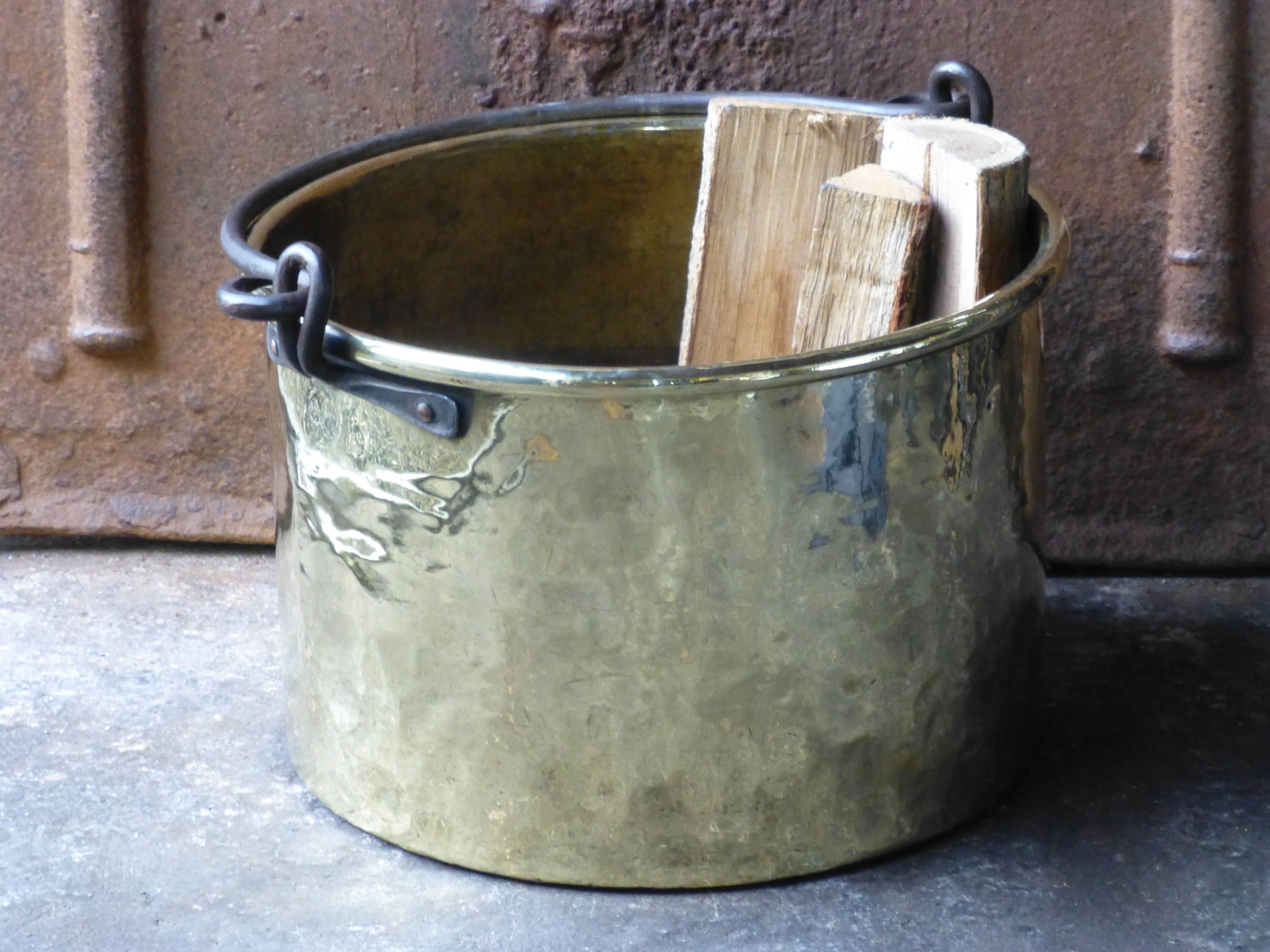 18th century Dutch log bin made of polished brass and wrought iron.