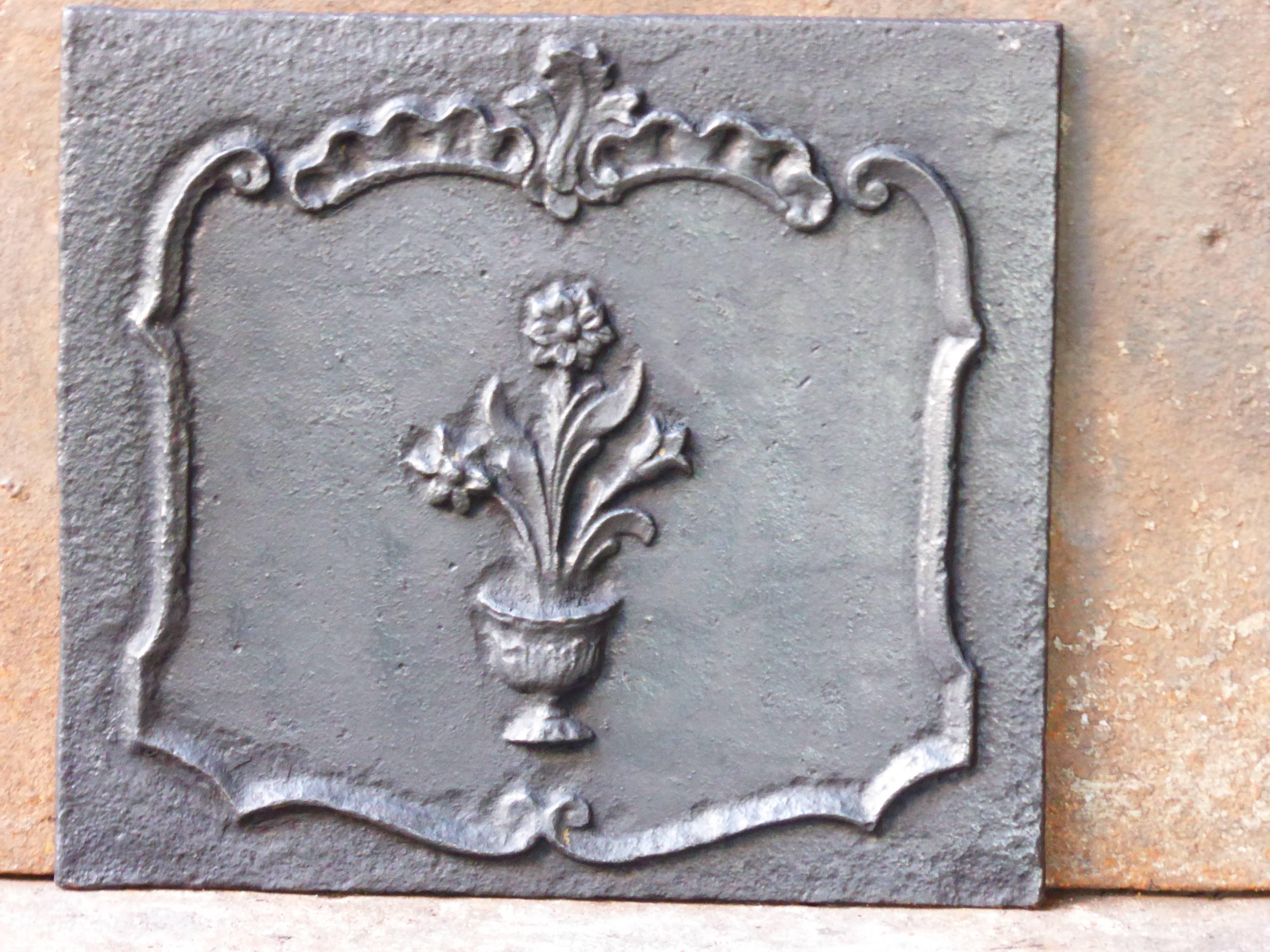 19th century French fireback with a flower basket.