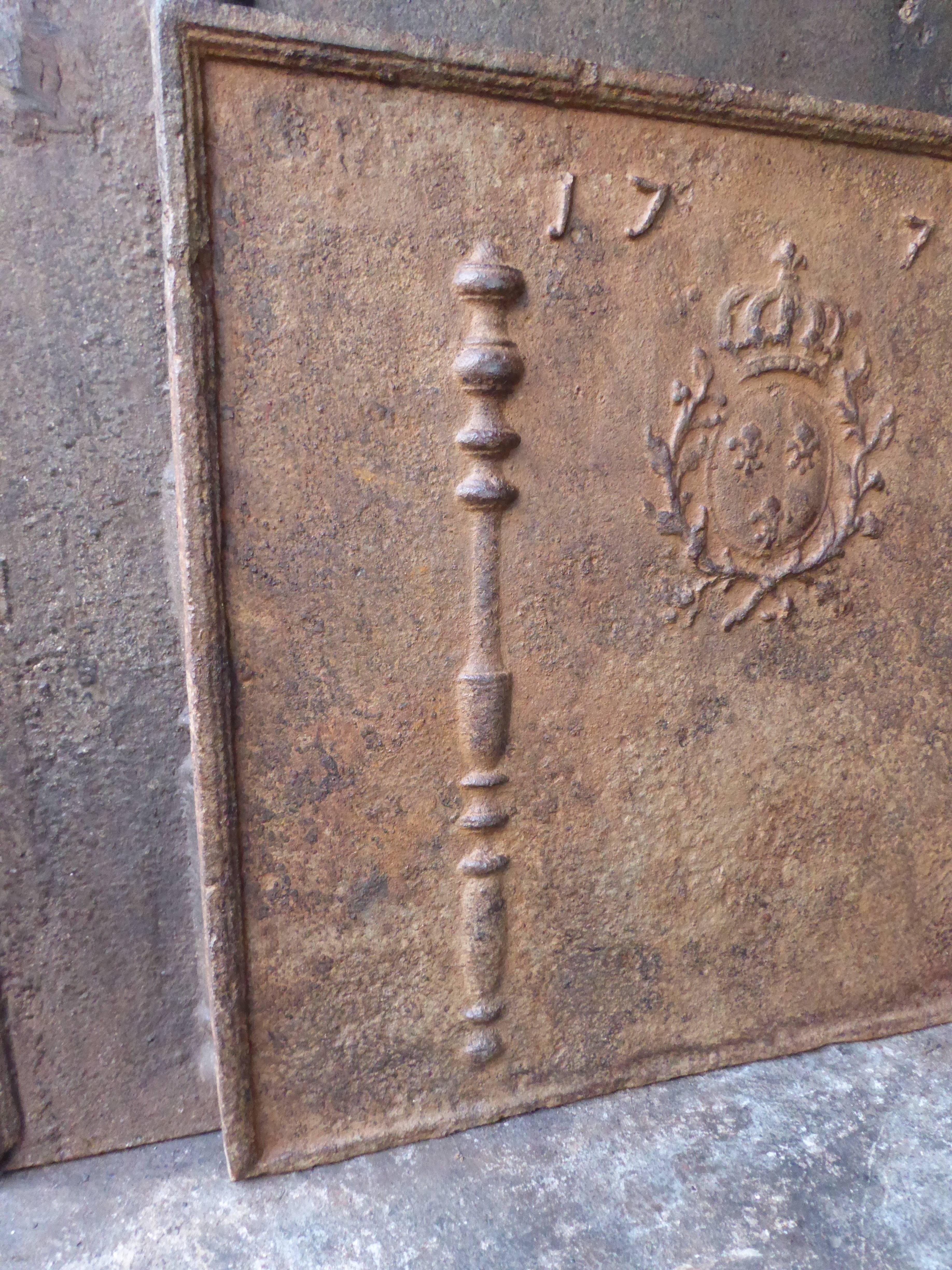 Fireback with the arms of France, two pillars and the date of production 1777.