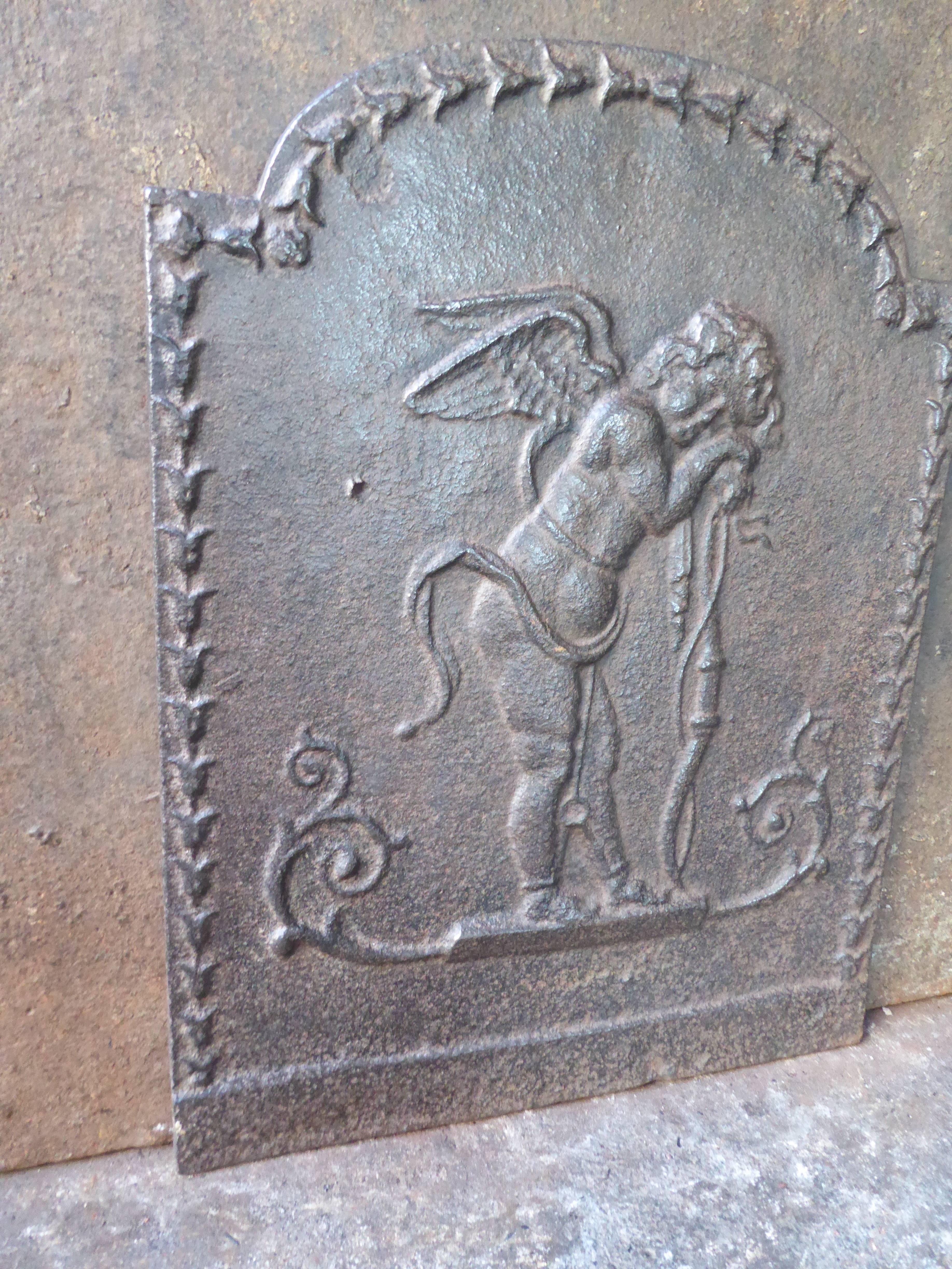 19th century French fireback with a cupid.