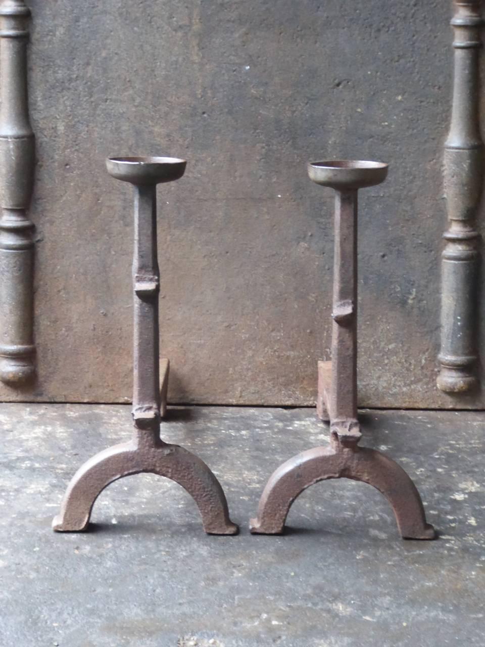 French 17th century Gothic firedogs.

With spit hooks to grill food and a cup to keep drinks or soup warm.