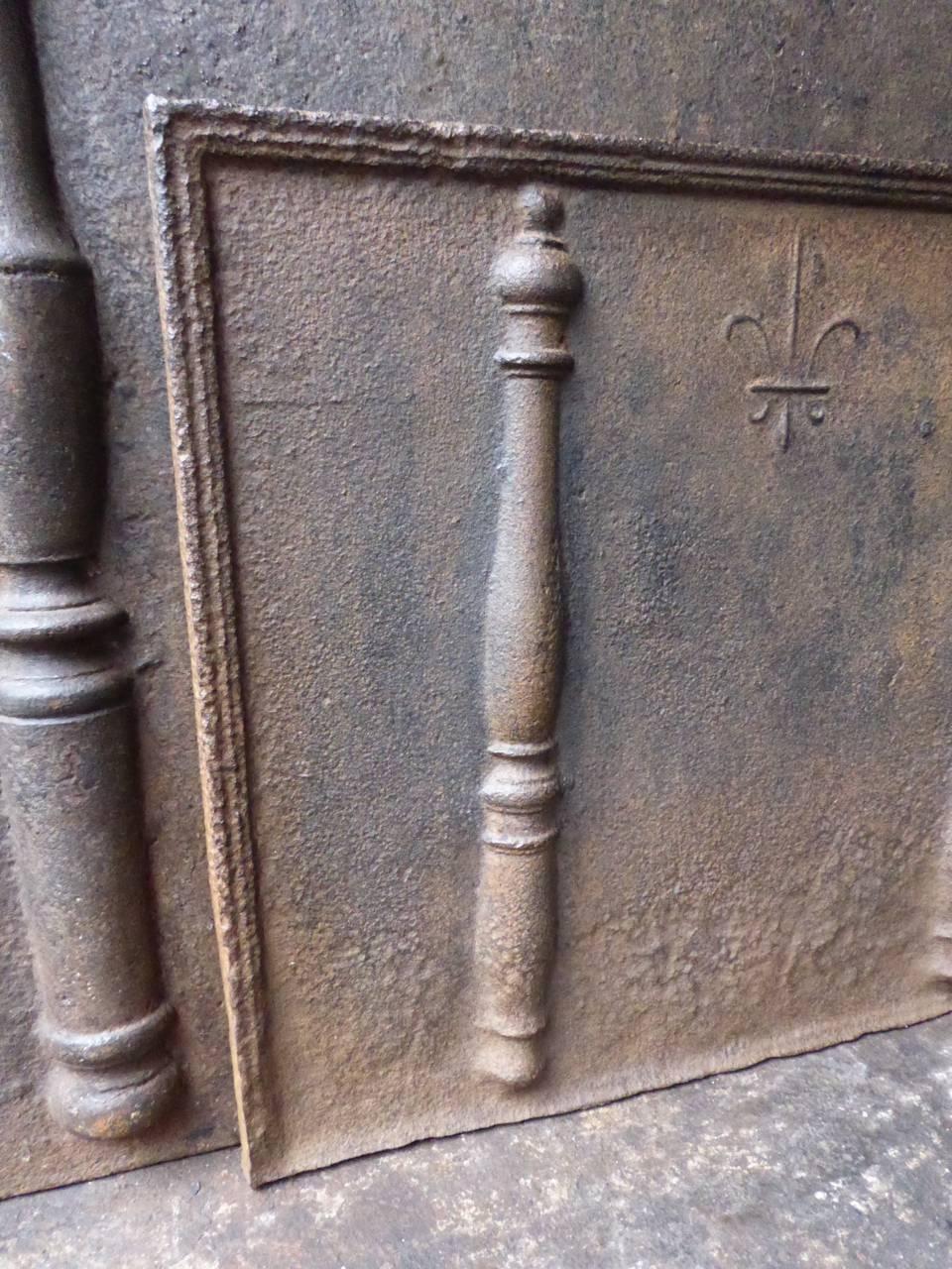 18th century French fireback with pillars and a Fleur de Lis.