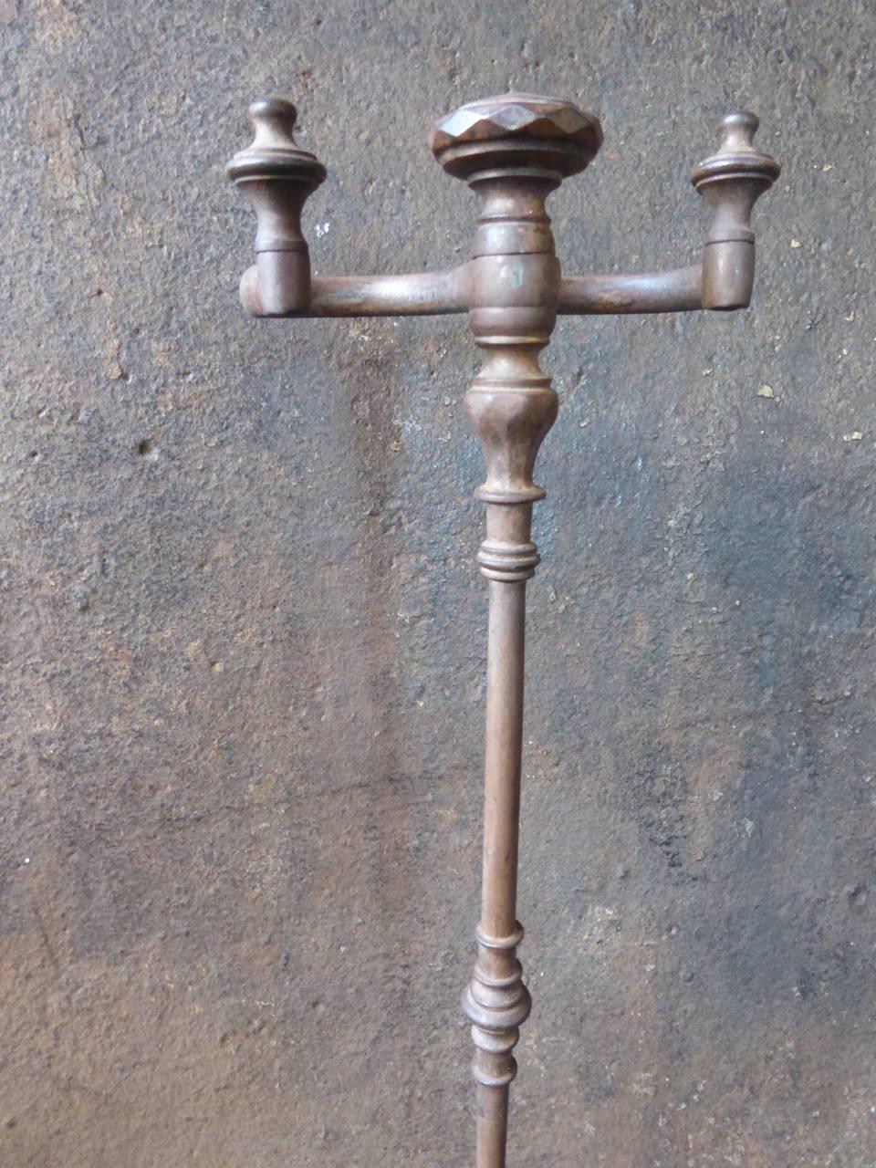 19th century French stand for fireplace tools made of wrought iron and brass.