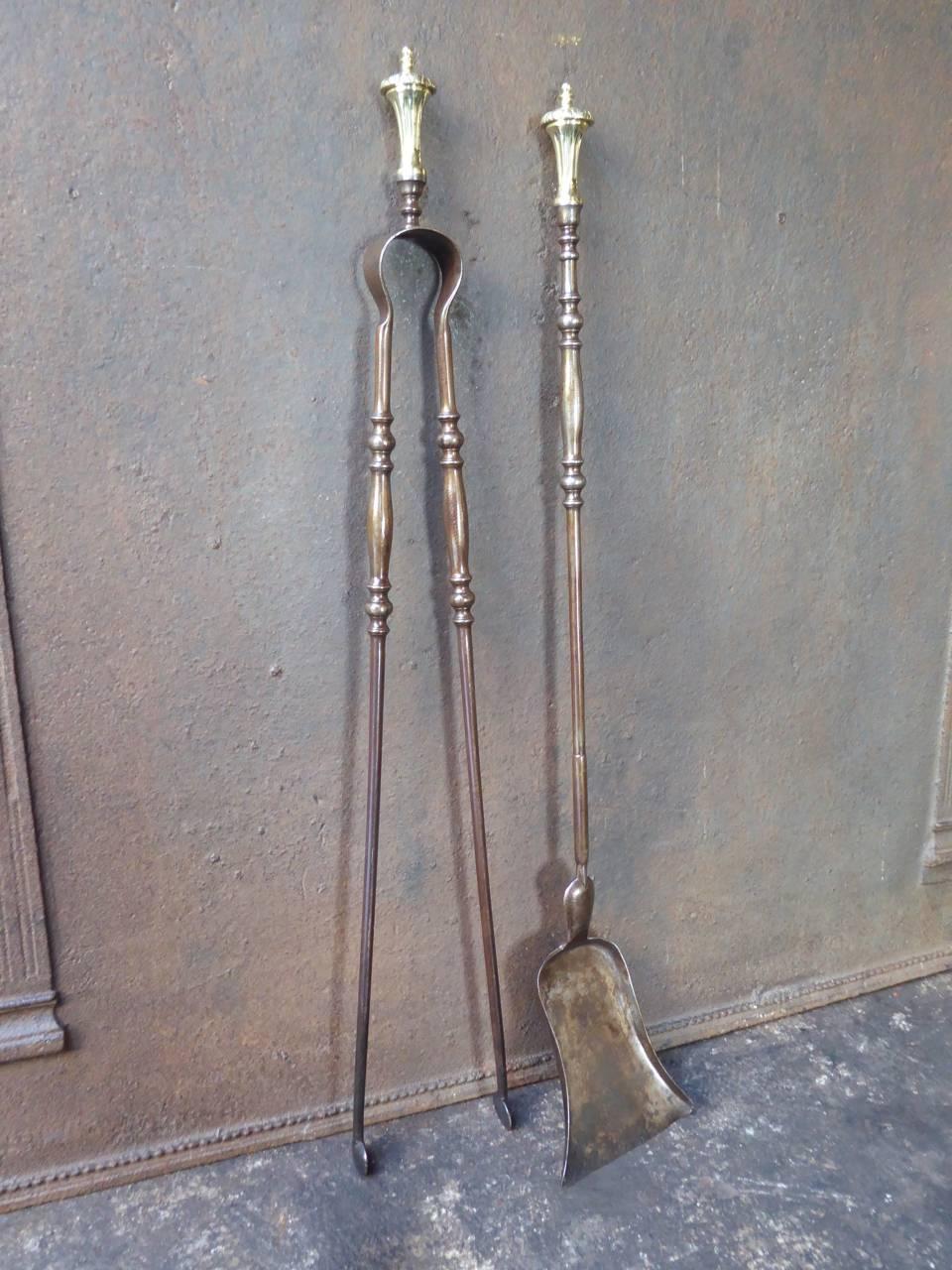 19th century French fireplace tools, fire irons made of wrought iron and polished brass.