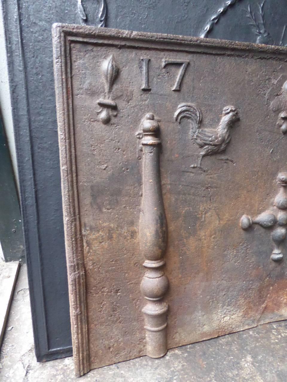 French fireback with pillars, chicken, fleur-de-lys and the date of production 1749.

We have a unique and specialized collection of antique and used fireplace accessories consisting of more than 1000 listings at 1stdibs. Amongst others we always