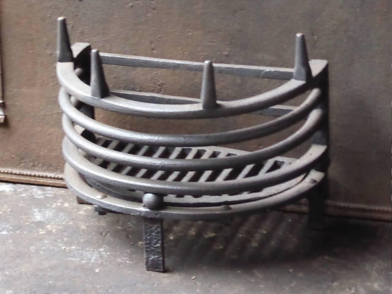 English fireplace grate made of cast iron.