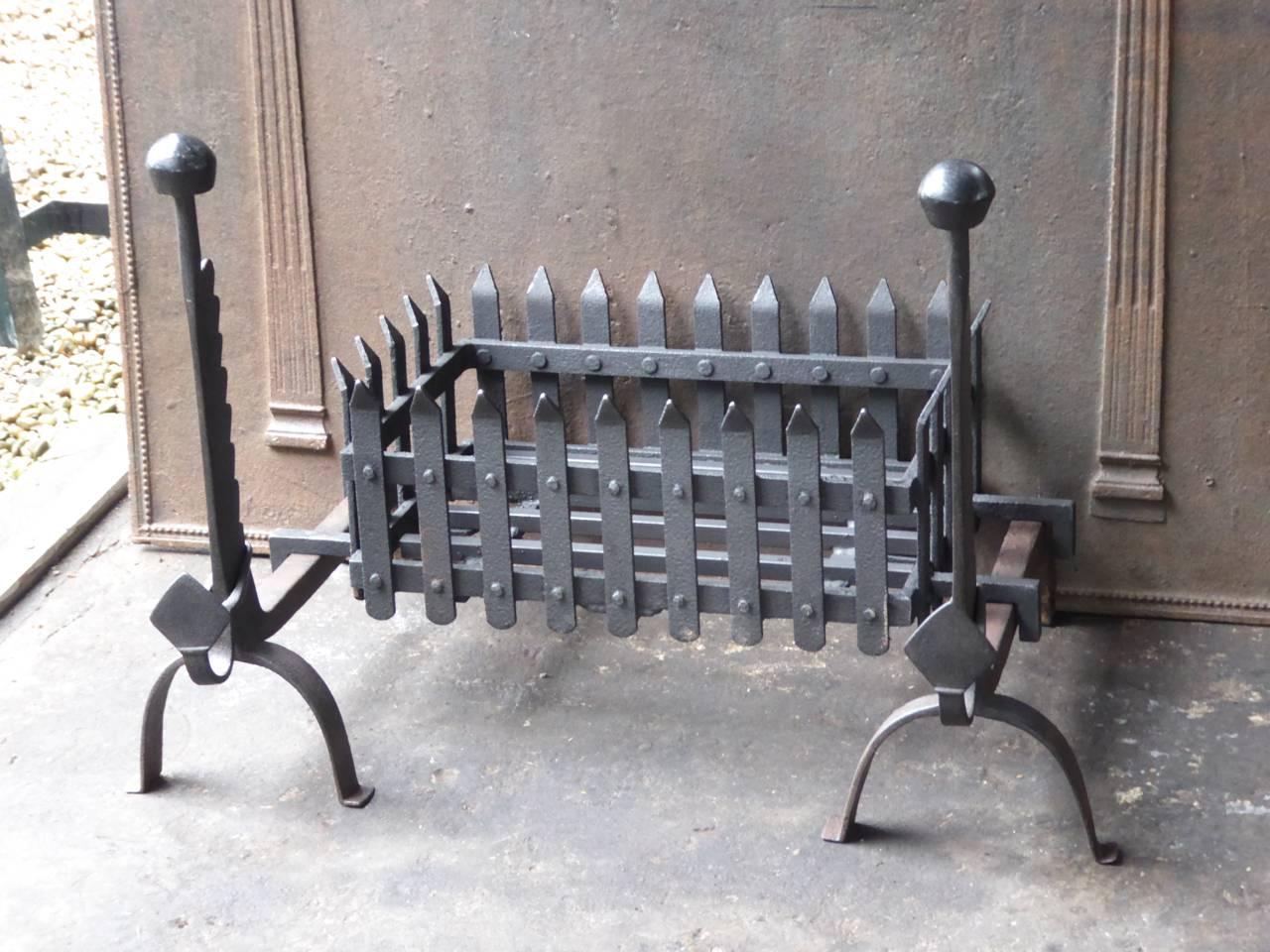 19th century English fireplace grate made of wrought iron.

The total width at the front is 81 cm.
 