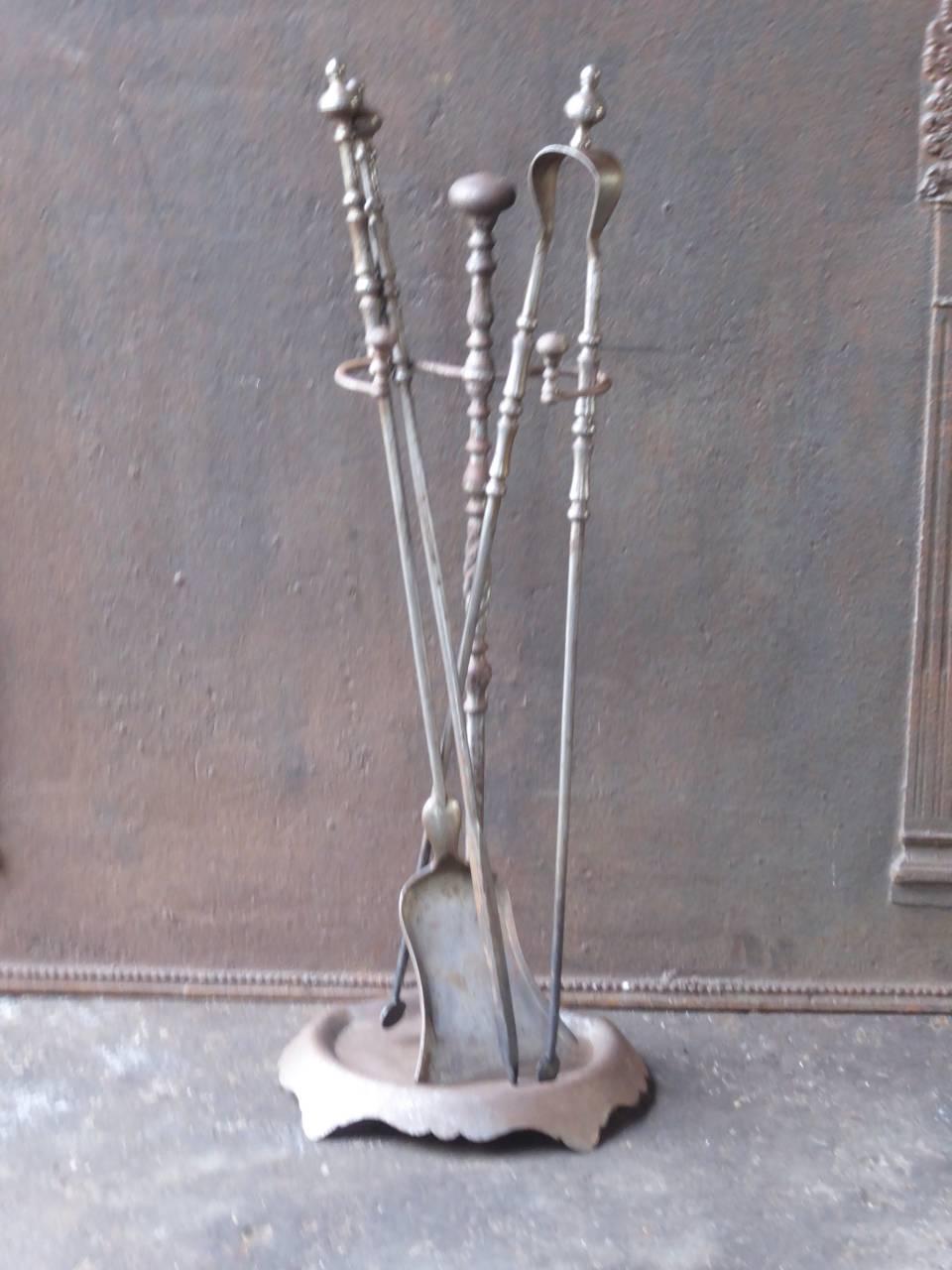 19th century French fireplace tools made of wrought iron.