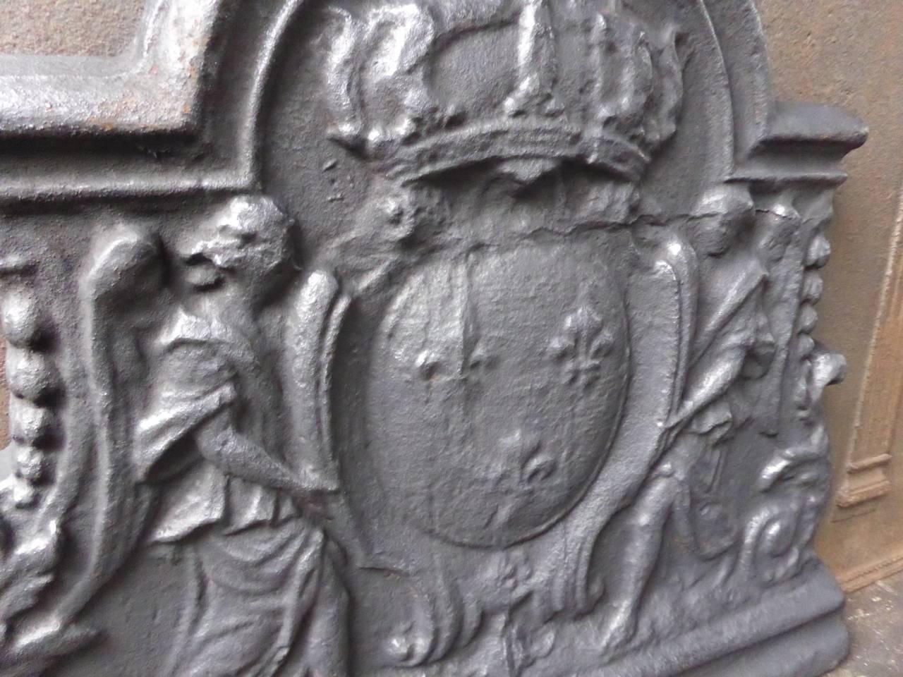 French fireback with the Arms of France. 

Coat of arms of the House of Bourbon, an originally French royal house that became a major dynasty in Europe. It delivered kings for Spain (Navarra), France, both Sicilies and Parma. Bourbon kings ruled