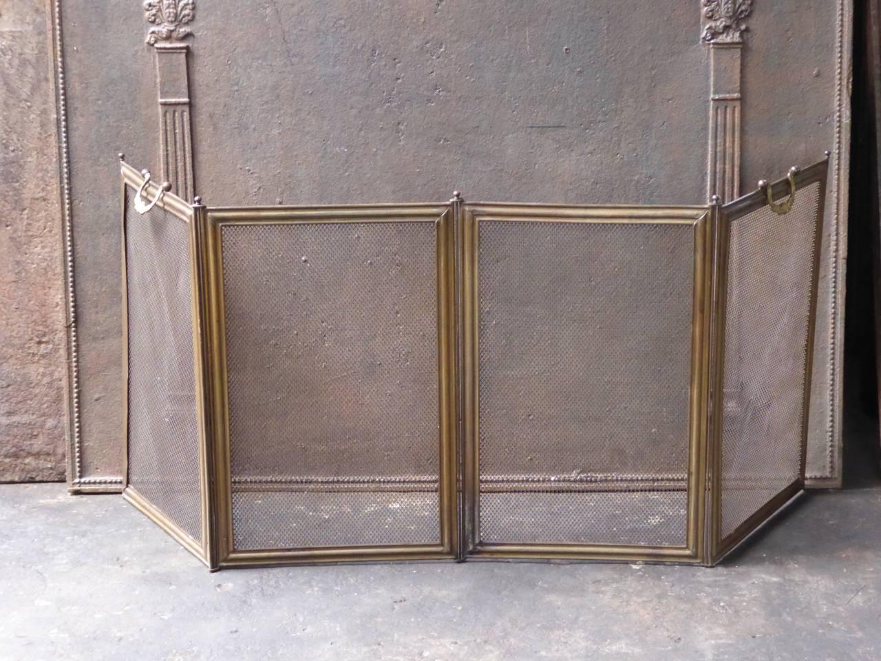19th century French fireplace screen made of brass, iron and iron mesh.