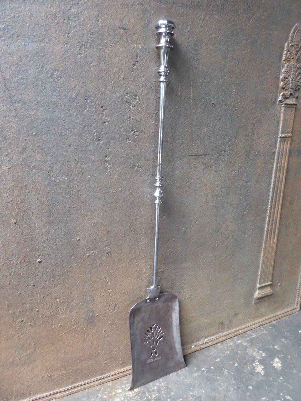 19th century English fireplace shovel made of polished steel.