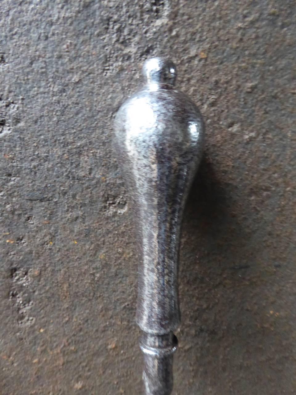 19th century English firepoker made of polished steel.