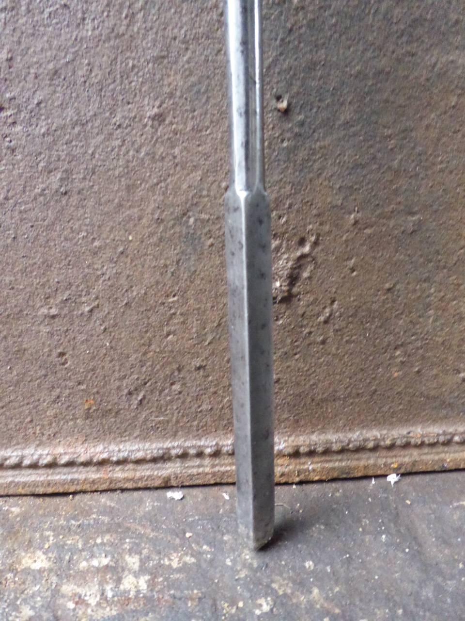 19th century English firepoker made of polished steel.