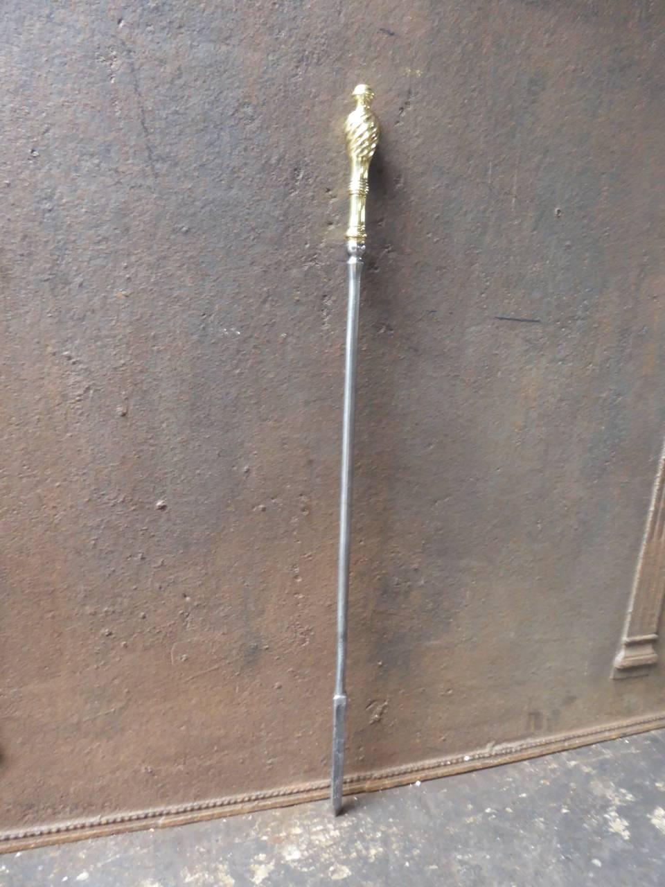 19th century English firepoker made of polished steel and polished brass.