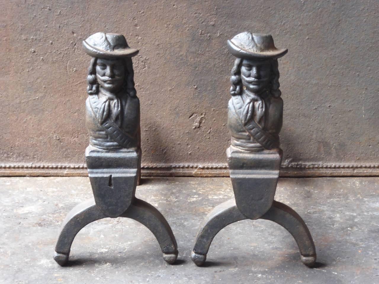 French D'Artagnan firedogs made of cast iron. D'Artagnan is the best known hero of the three musketeers.