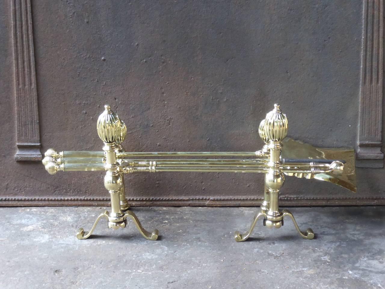 English fireplace tool set, fire irons made of polished brass.

We have a unique and specialized collection of antique and used fireplace accessories consisting of more than 1000 listings at 1stdibs. Amongst others, we always have 300+ firebacks,