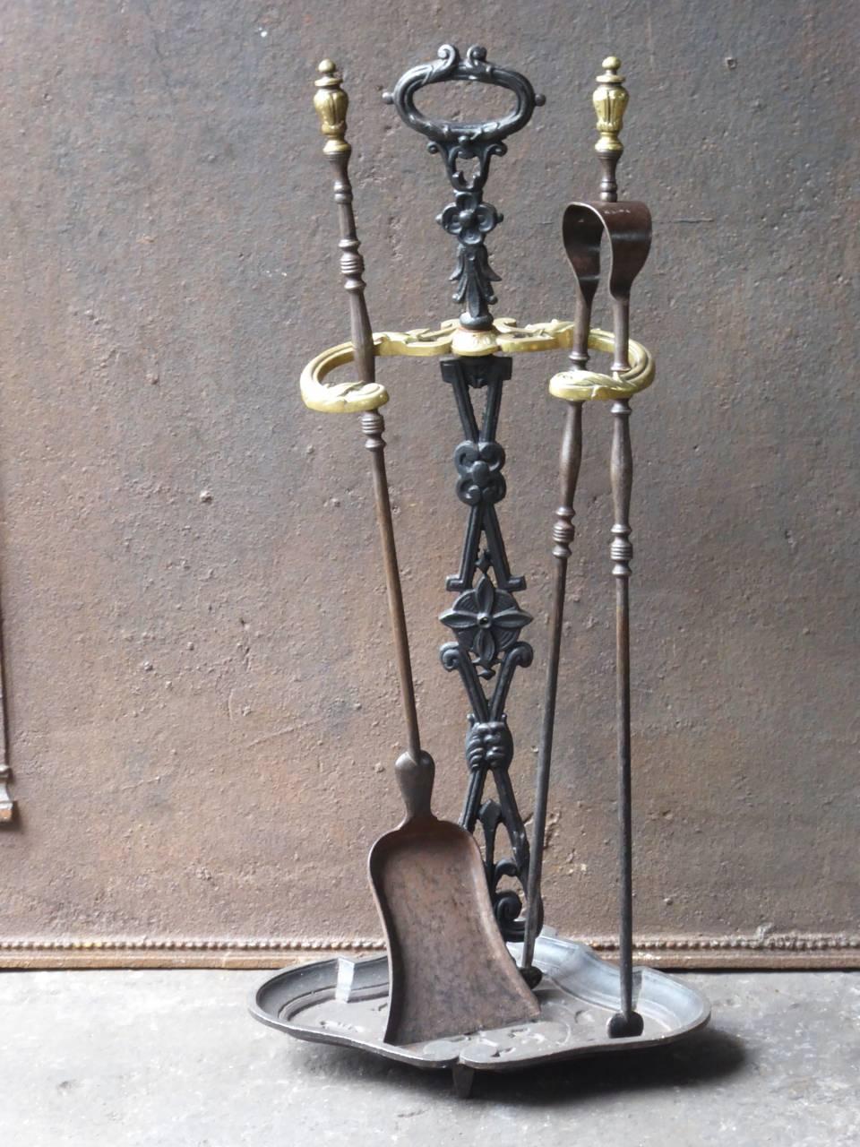 19th century French fireplace tool set fire irons made of cast iron, wrought iron and brass.

We have a unique and specialized collection of antique and used fireplace accessories consisting of more than 1000 listings at 1stdibs. Amongst others, we