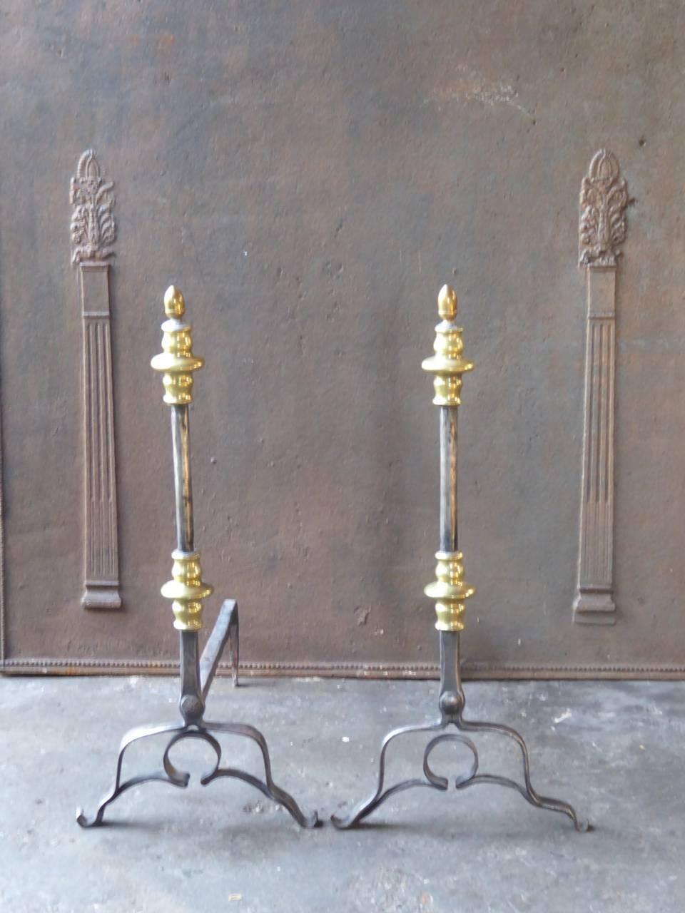 Beautiful 17th century Dutch fire dogs made of wrought iron and polished brass.

We have a unique and specialized collection of antique and used fireplace accessories consisting of more than 1000 listings at 1stdibs. Amongst others, we always have