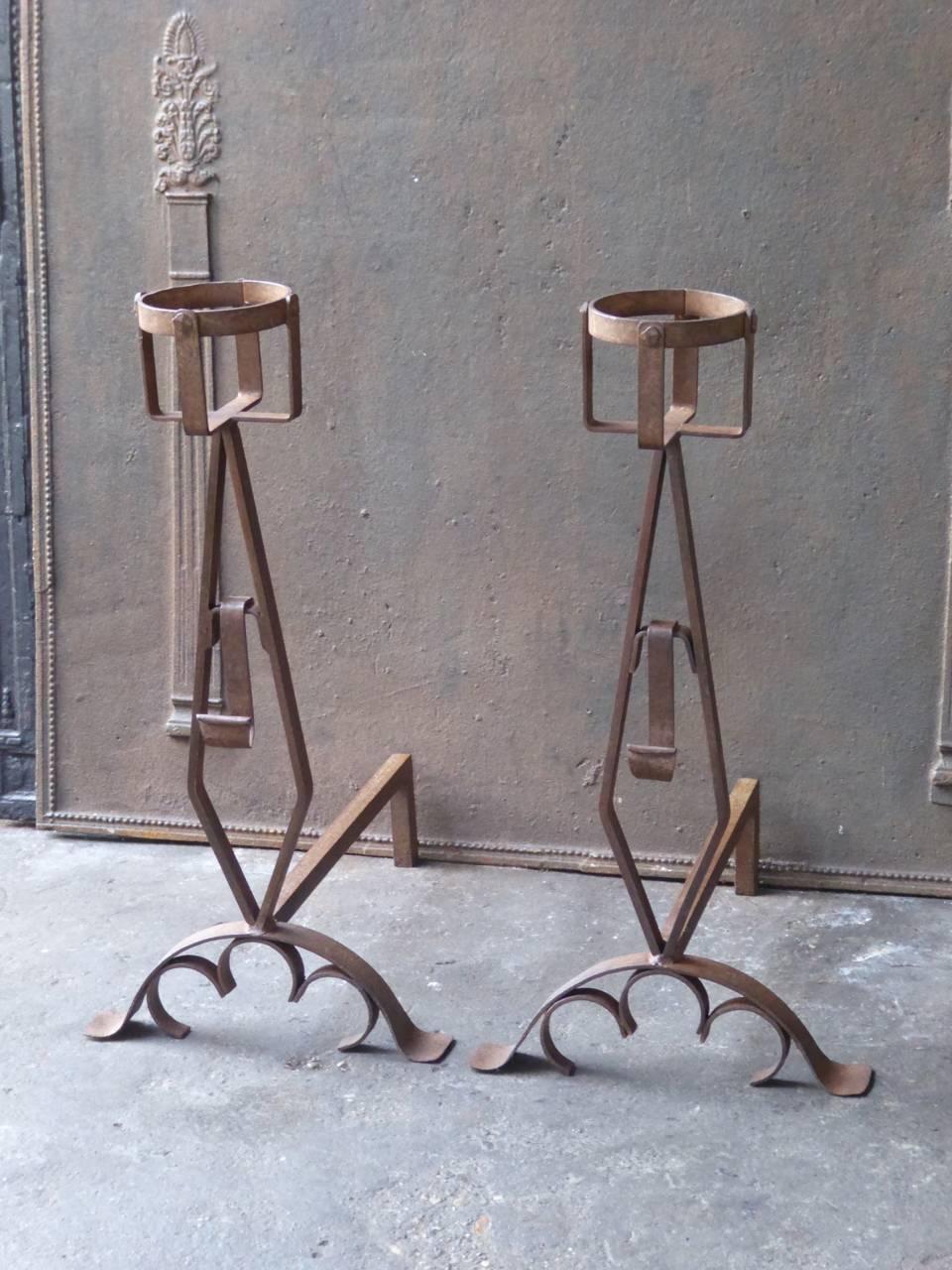 French andirons made of wrought iron. The condition of the andirons is good.

