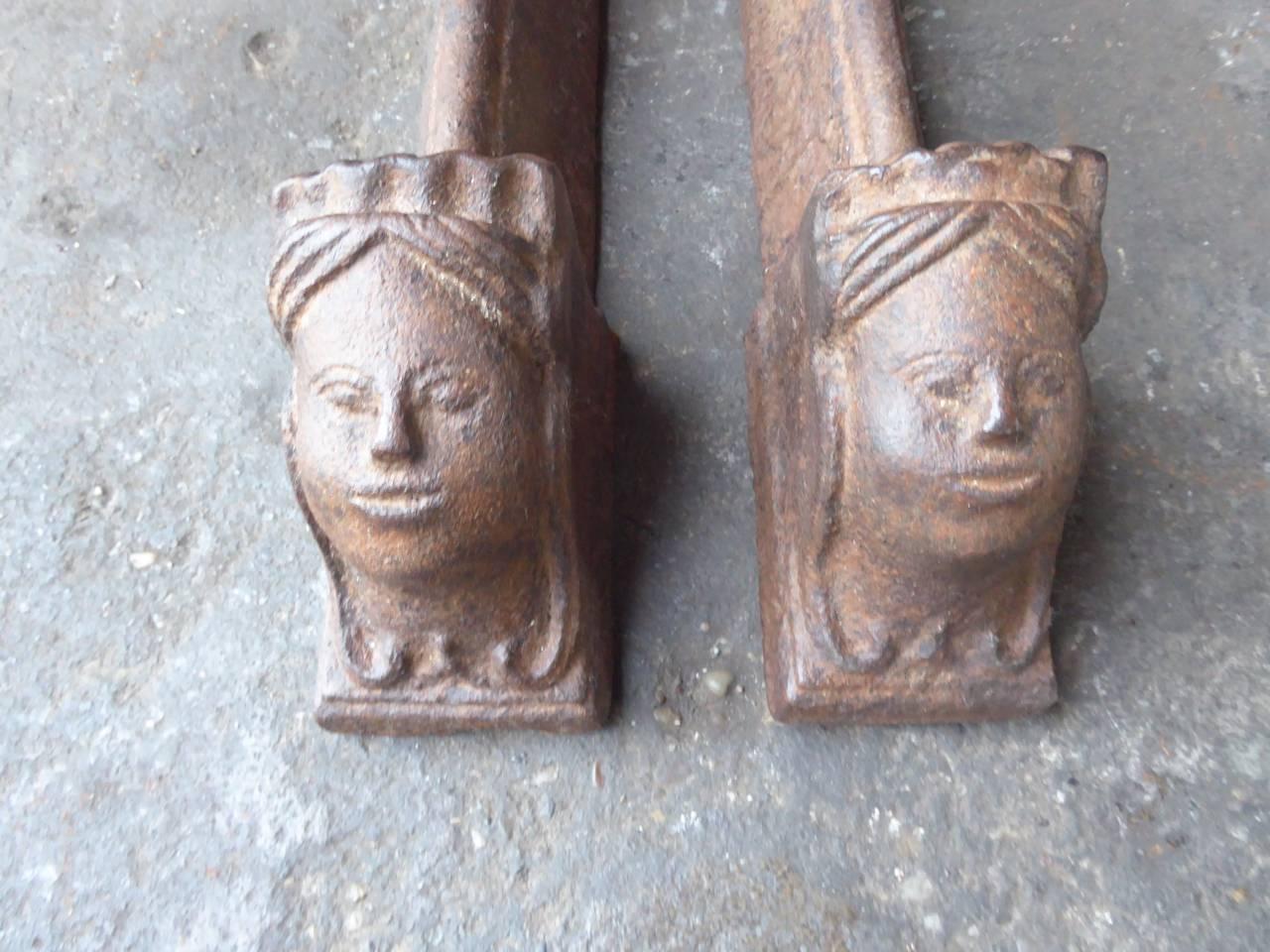 18th century French Louis XV fire dogs made of cast iron. The andirons have a natural brown patina. Upon request they can be made black. The condition of the andirons is good.

